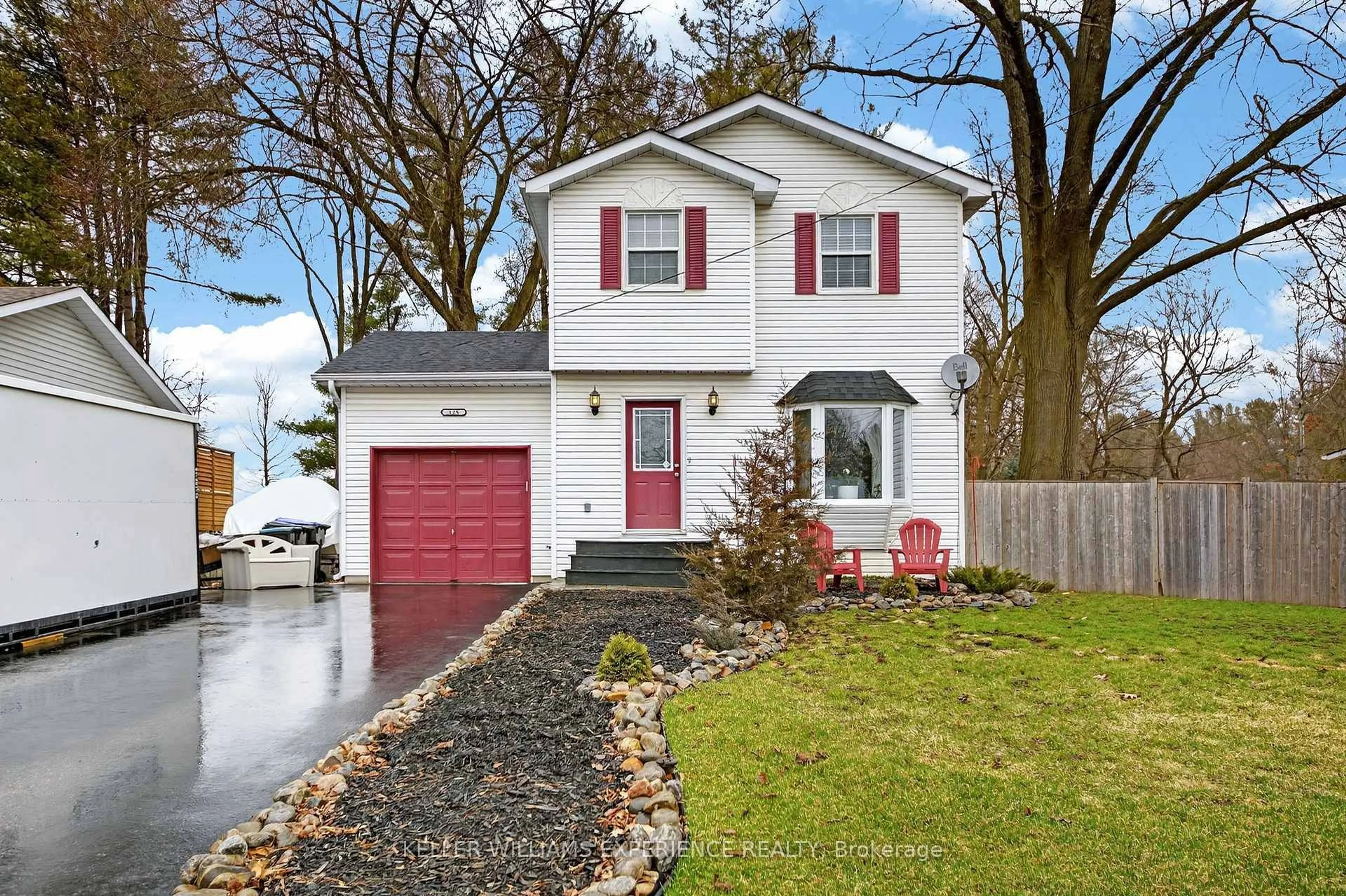 Home with vinyl exterior material, street for 125 SIMCOE St, Essa Ontario L0M 1B0