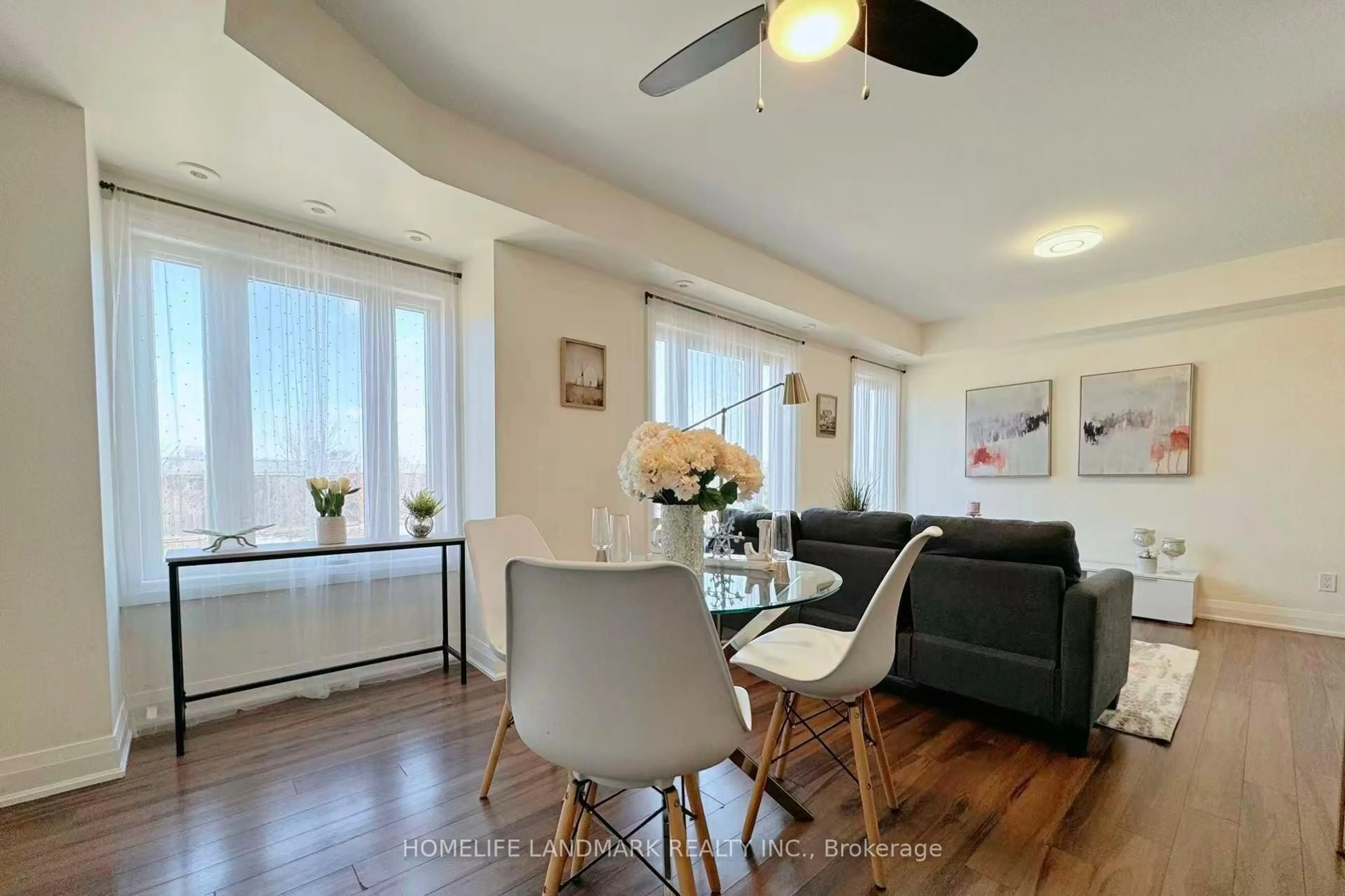 Living room with furniture, wood/laminate floor for 320 John St #215, Markham Ontario L3T 0B1