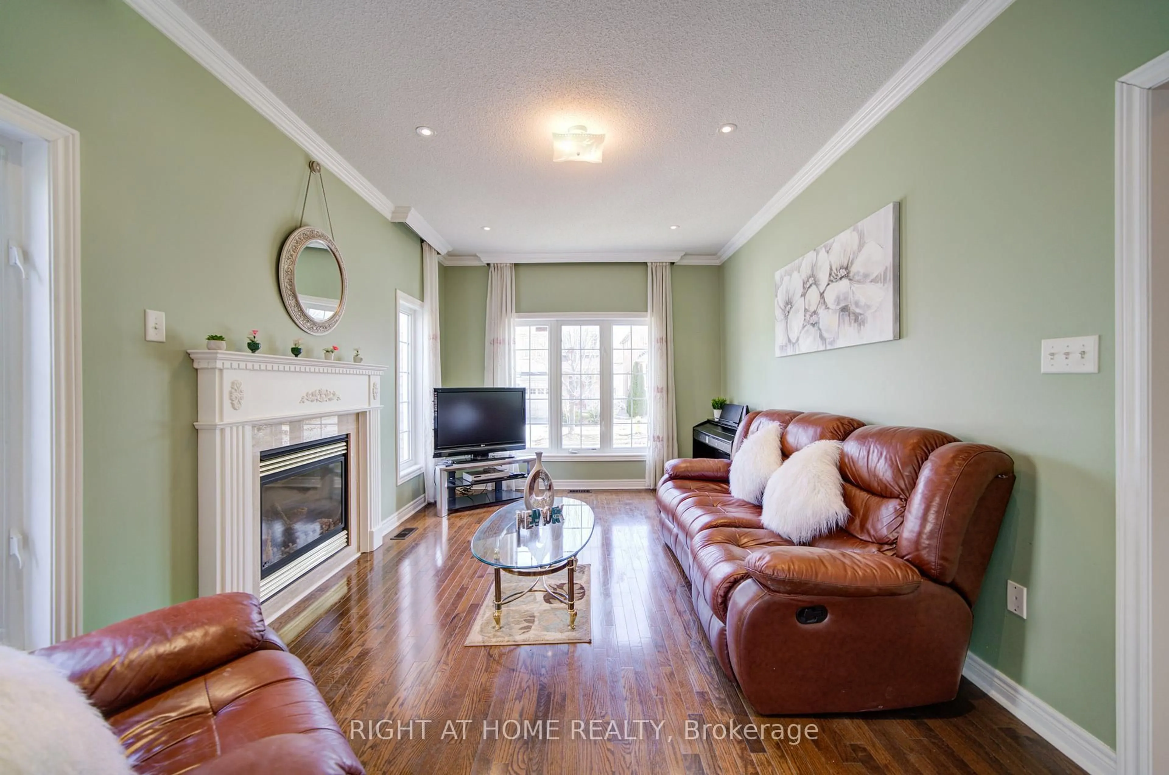 Living room with furniture, wood/laminate floor for 115 Westolivia Tr, Vaughan Ontario L4J 0C2