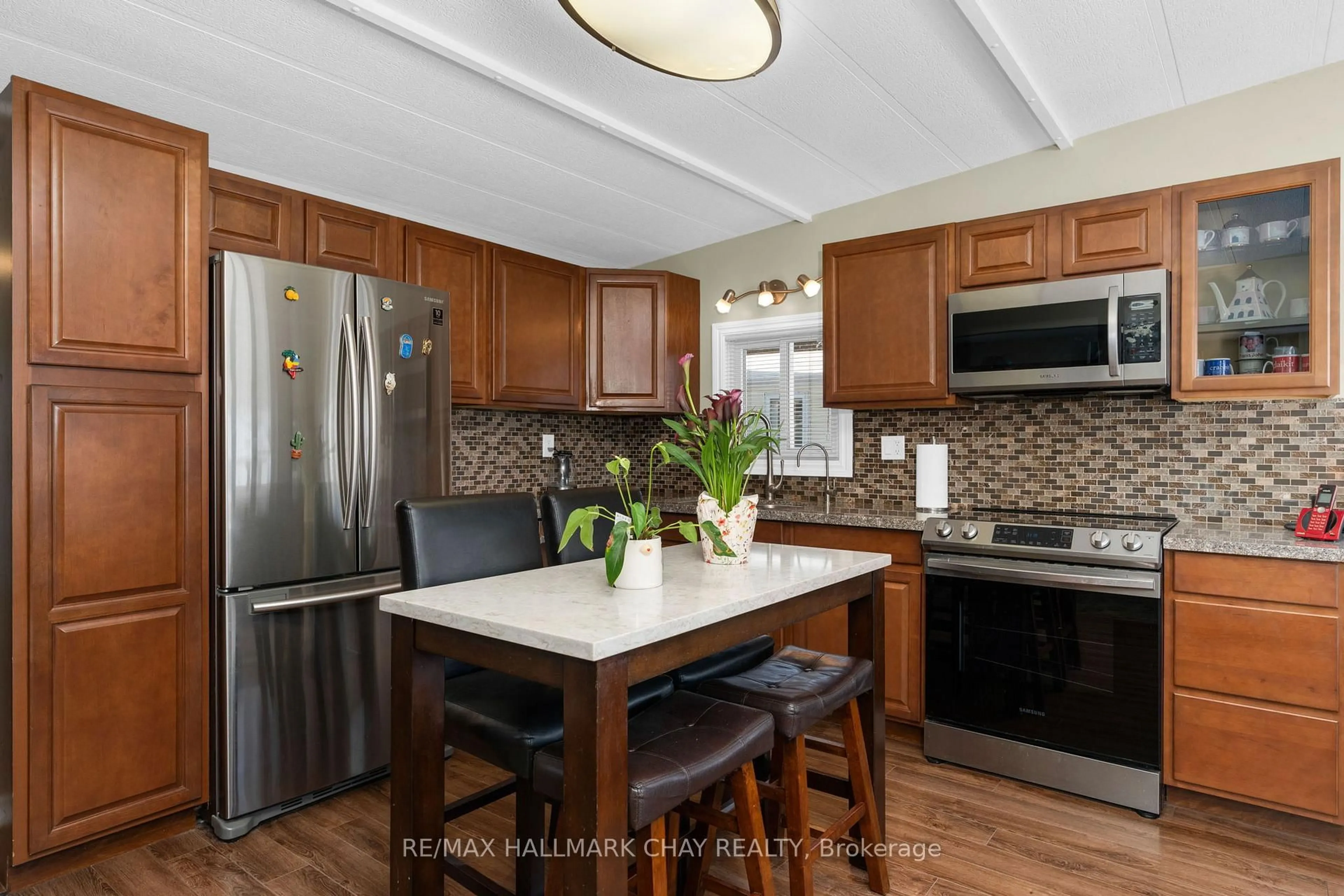 Open concept kitchen, ceramic/tile floor for 4976 25th Sdrd #42, Essa Ontario L0L 1N0