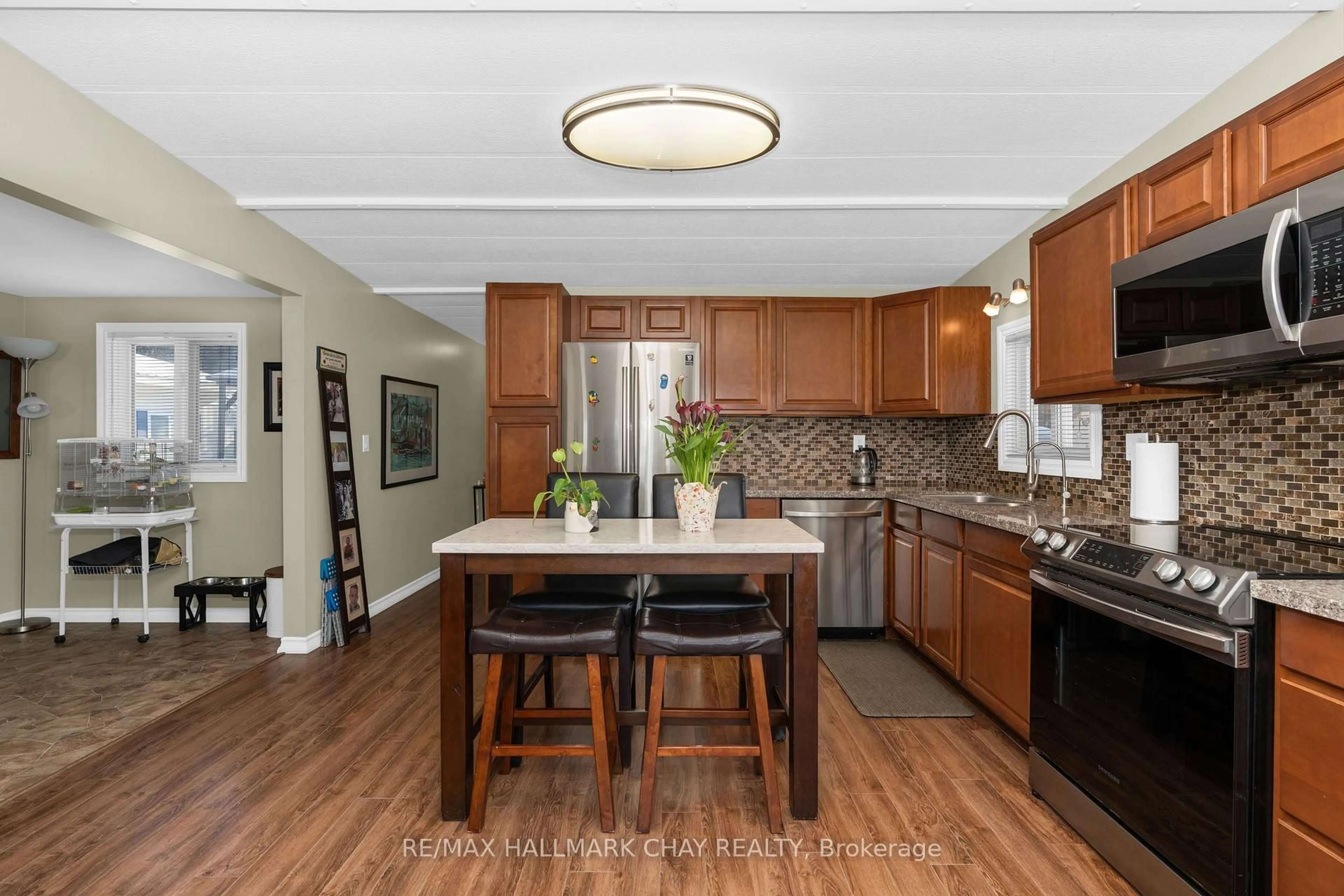 Open concept kitchen, ceramic/tile floor for 4976 25th Sdrd #42, Essa Ontario L0L 1N0