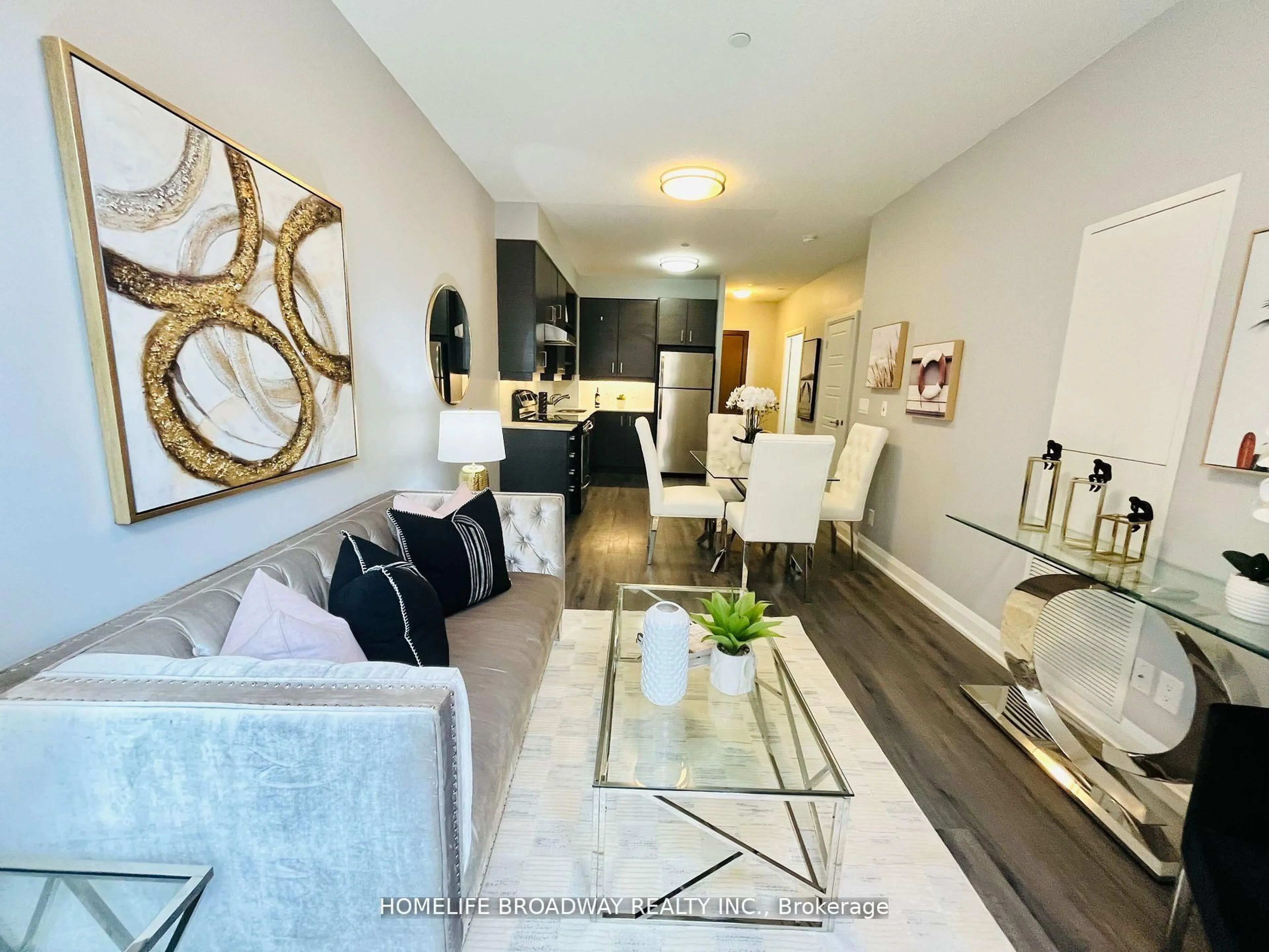 Living room with furniture, wood/laminate floor for 8228 Birchmount Rd #106, Markham Ontario L3R 1A6