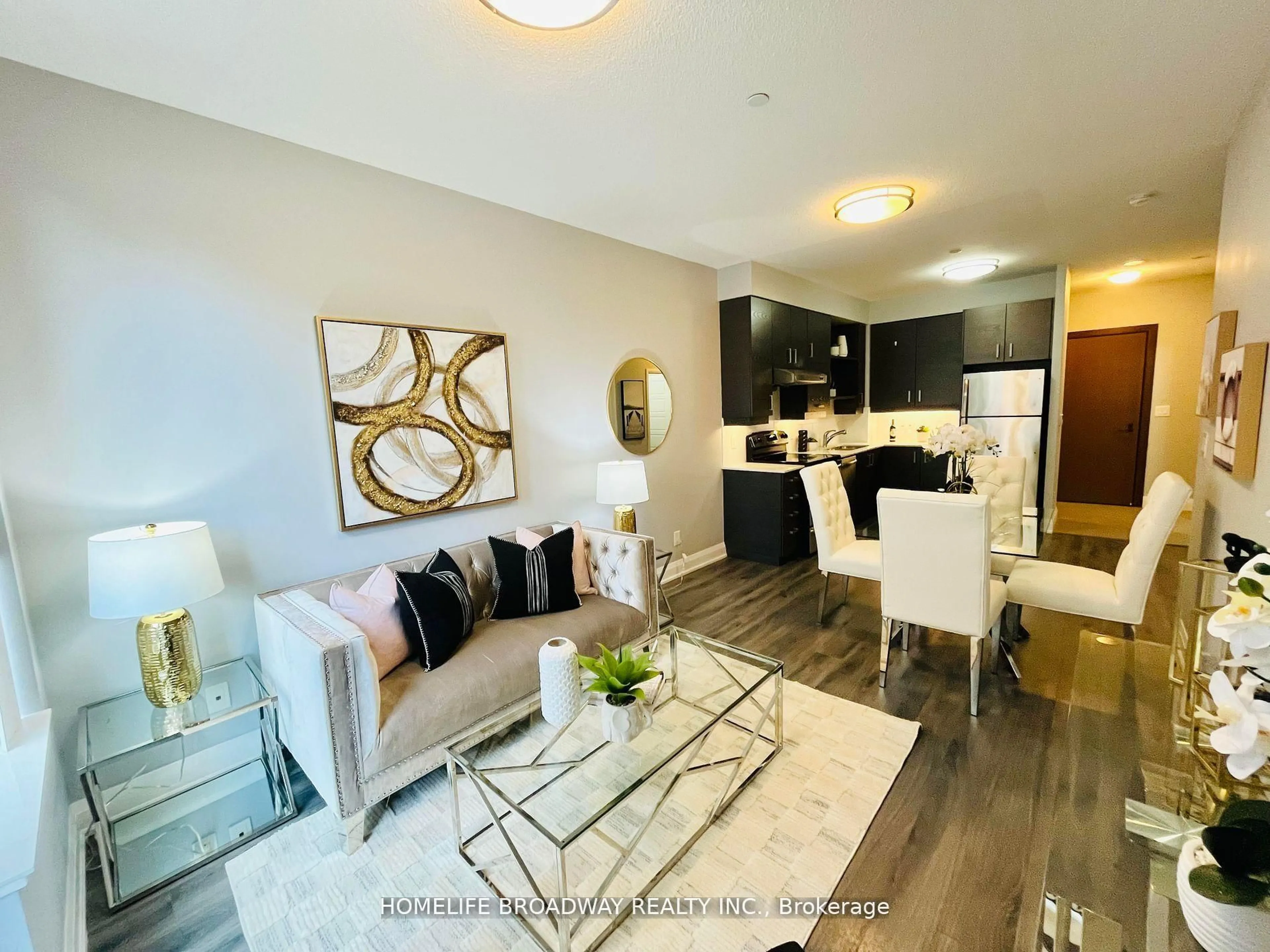 Living room with furniture, wood/laminate floor for 8228 Birchmount Rd #106, Markham Ontario L3R 1A6