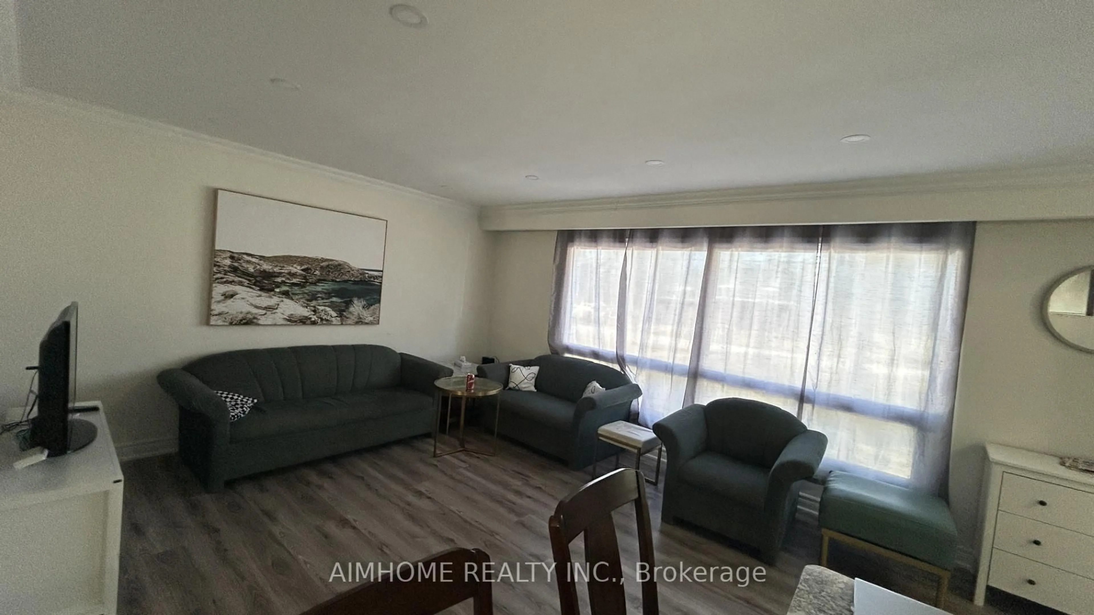 Living room with furniture, wood/laminate floor for 151 Riveredge Dr, Georgina Ontario L4P 2P4