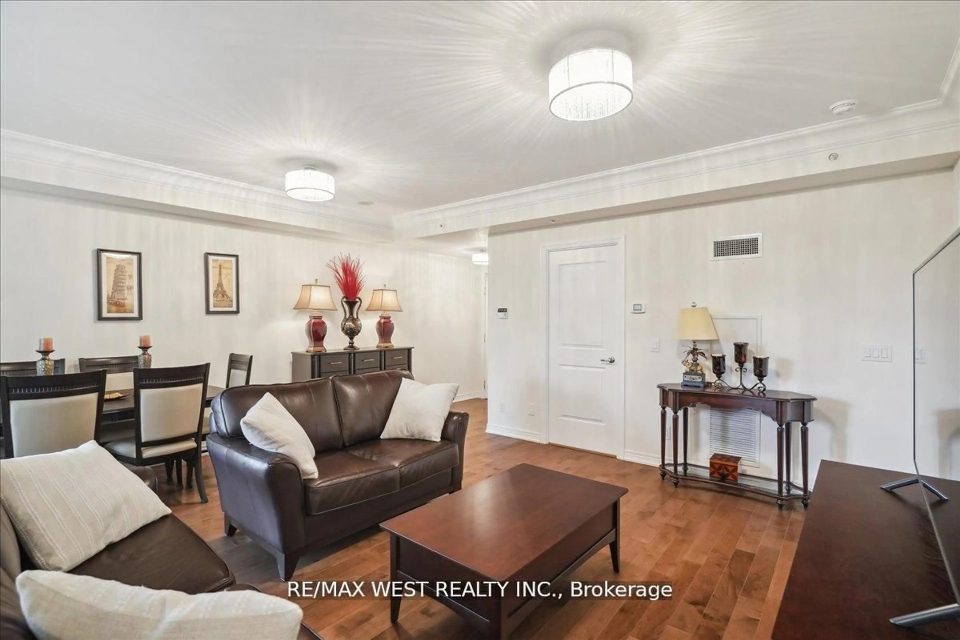 Living room with furniture, wood/laminate floor for 9255 Jane St #405, Vaughan Ontario L6A 0K1