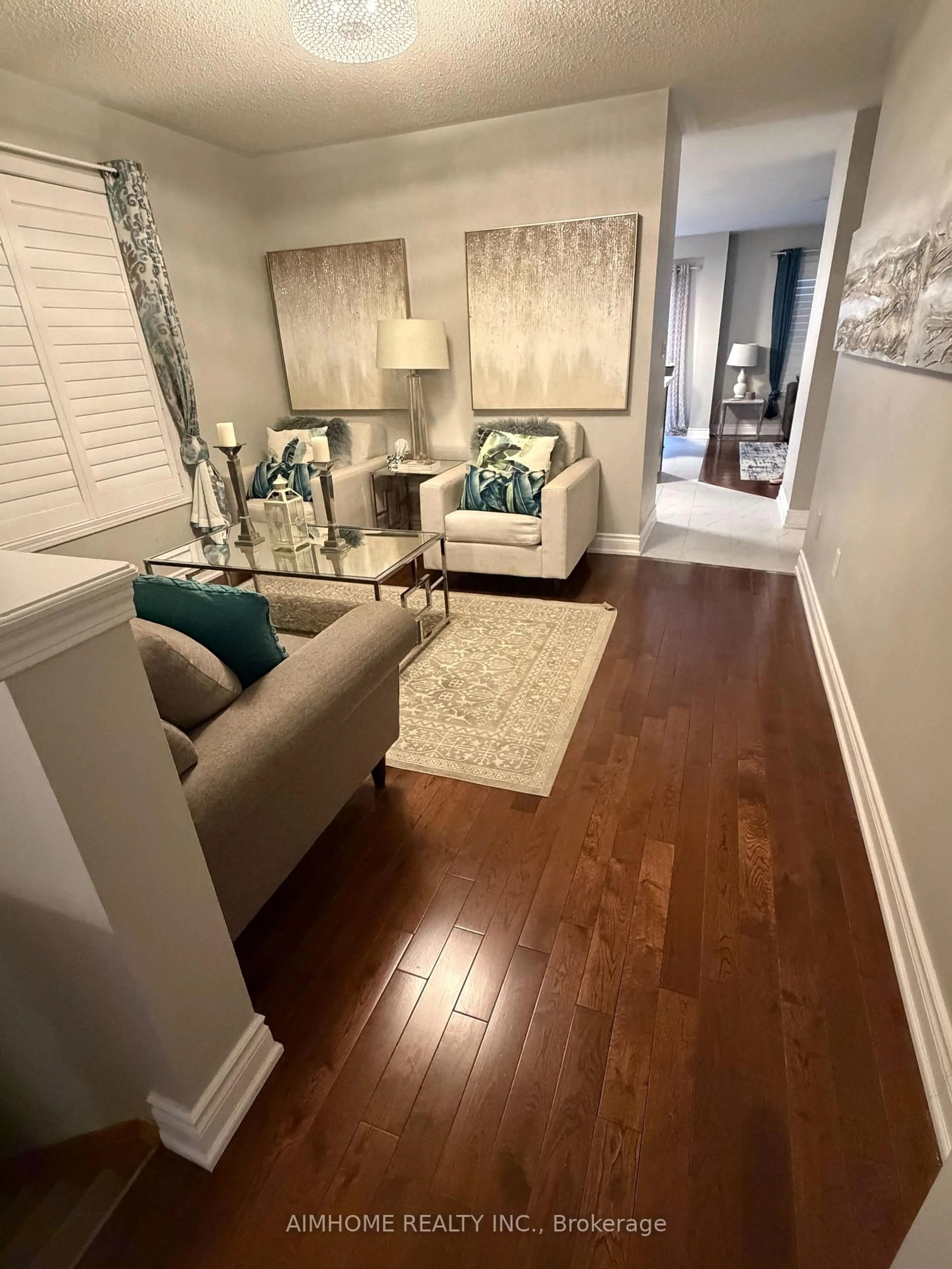 Living room with furniture, wood/laminate floor for 49 Fred Silvester Rd, Whitchurch-Stouffville Ontario L4A 0J6