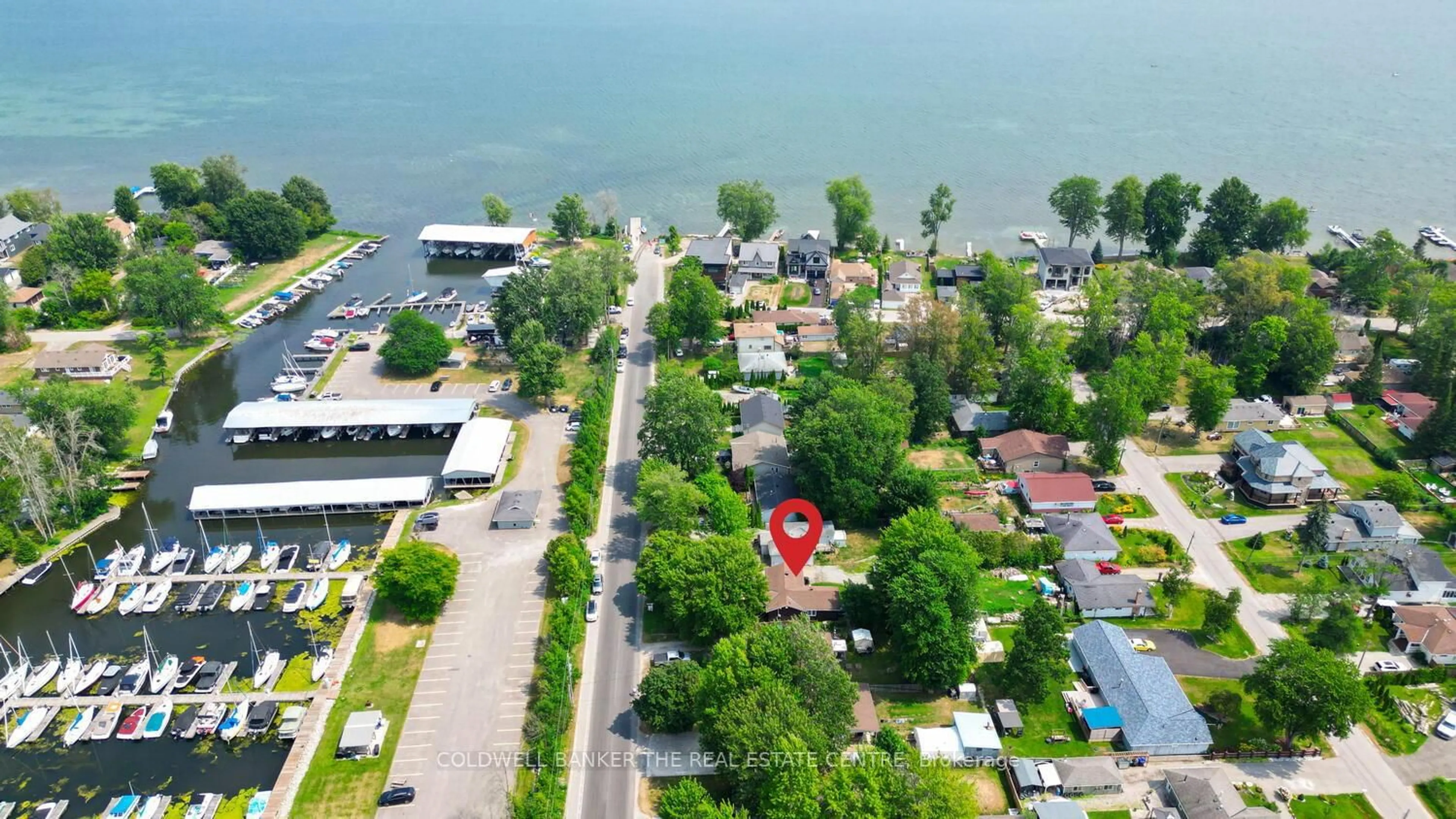 A pic from outside/outdoor area/front of a property/back of a property/a pic from drone, water/lake/river/ocean view for 1127 Shore Acres Dr, Innisfil Ontario L0L 1R0