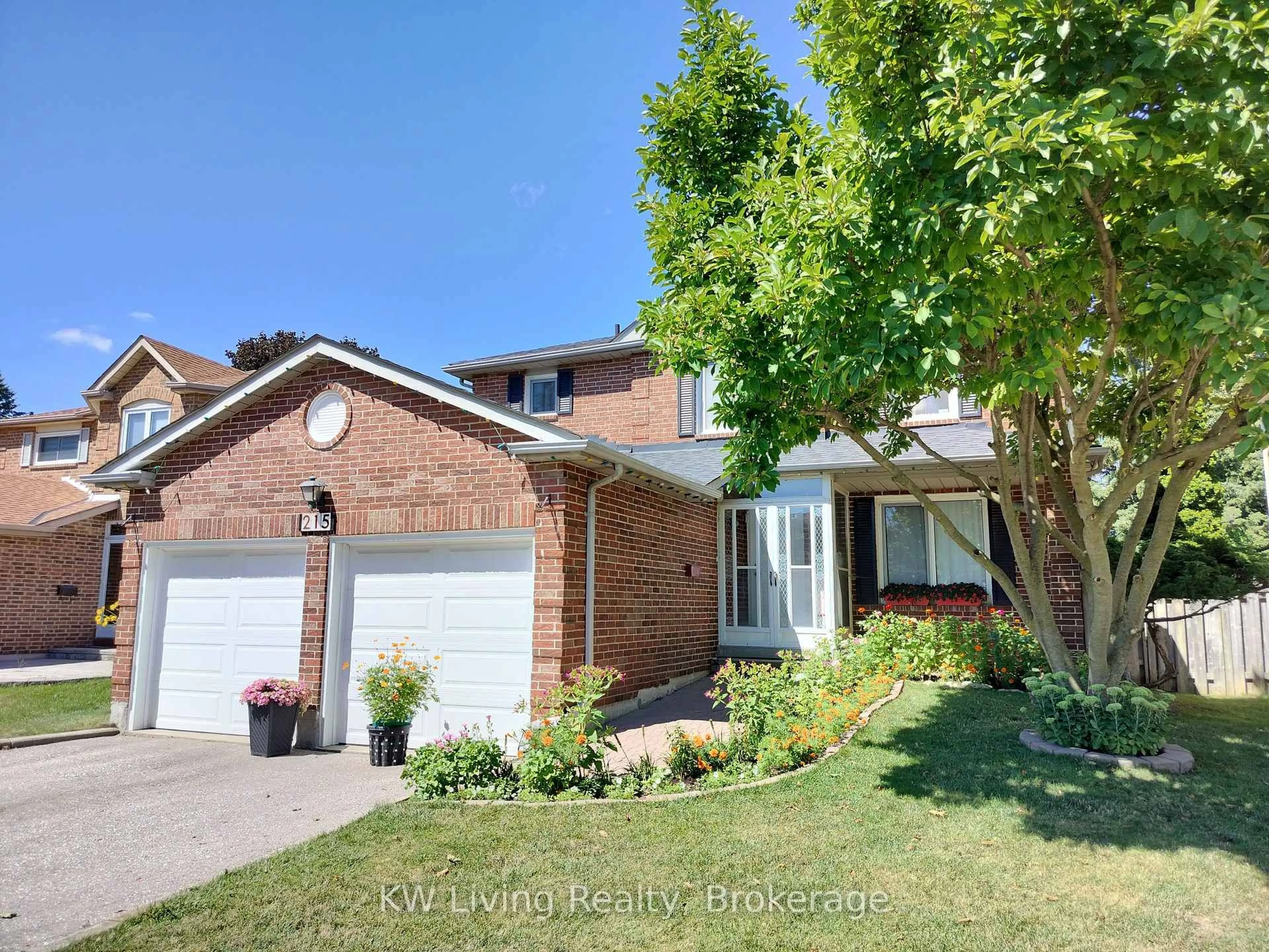Home with brick exterior material, street for 215 Hollingham Rd, Markham Ontario L3R 8K4
