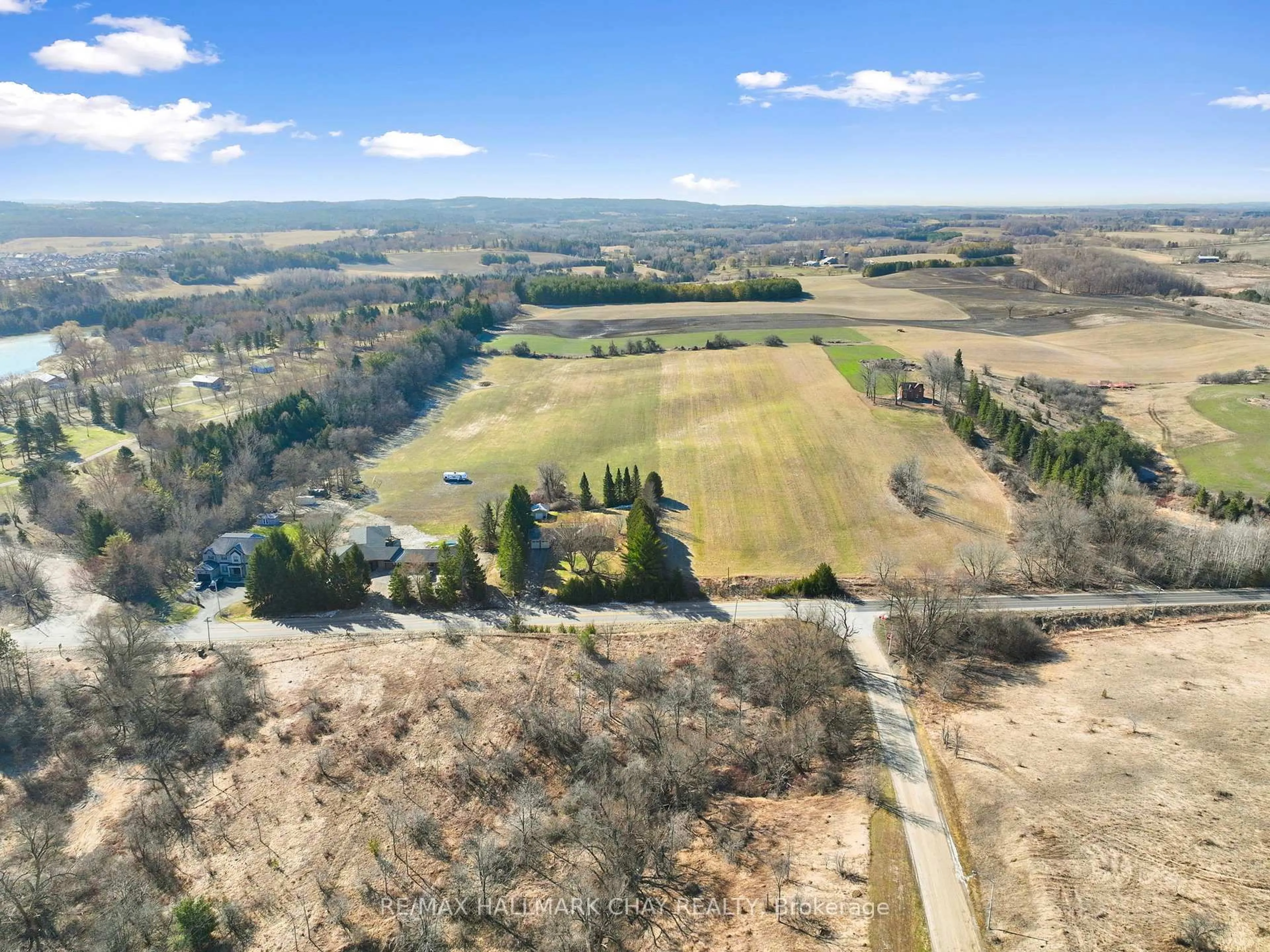 A pic from outside/outdoor area/front of a property/back of a property/a pic from drone, forest/trees view for 6815 4th Line, New Tecumseth Ontario L0G 1W0