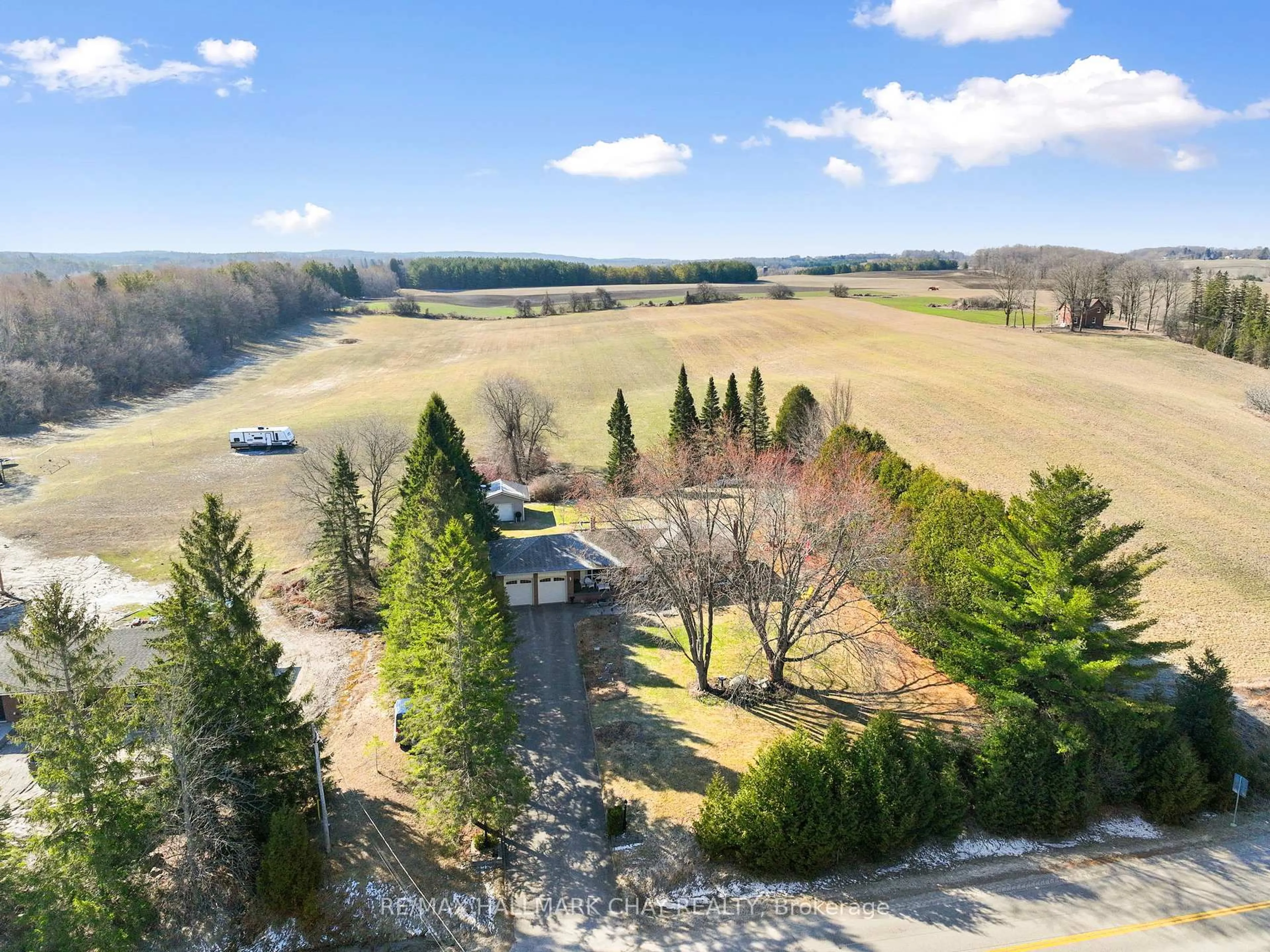 A pic from outside/outdoor area/front of a property/back of a property/a pic from drone, forest/trees view for 6815 4th Line, New Tecumseth Ontario L0G 1W0
