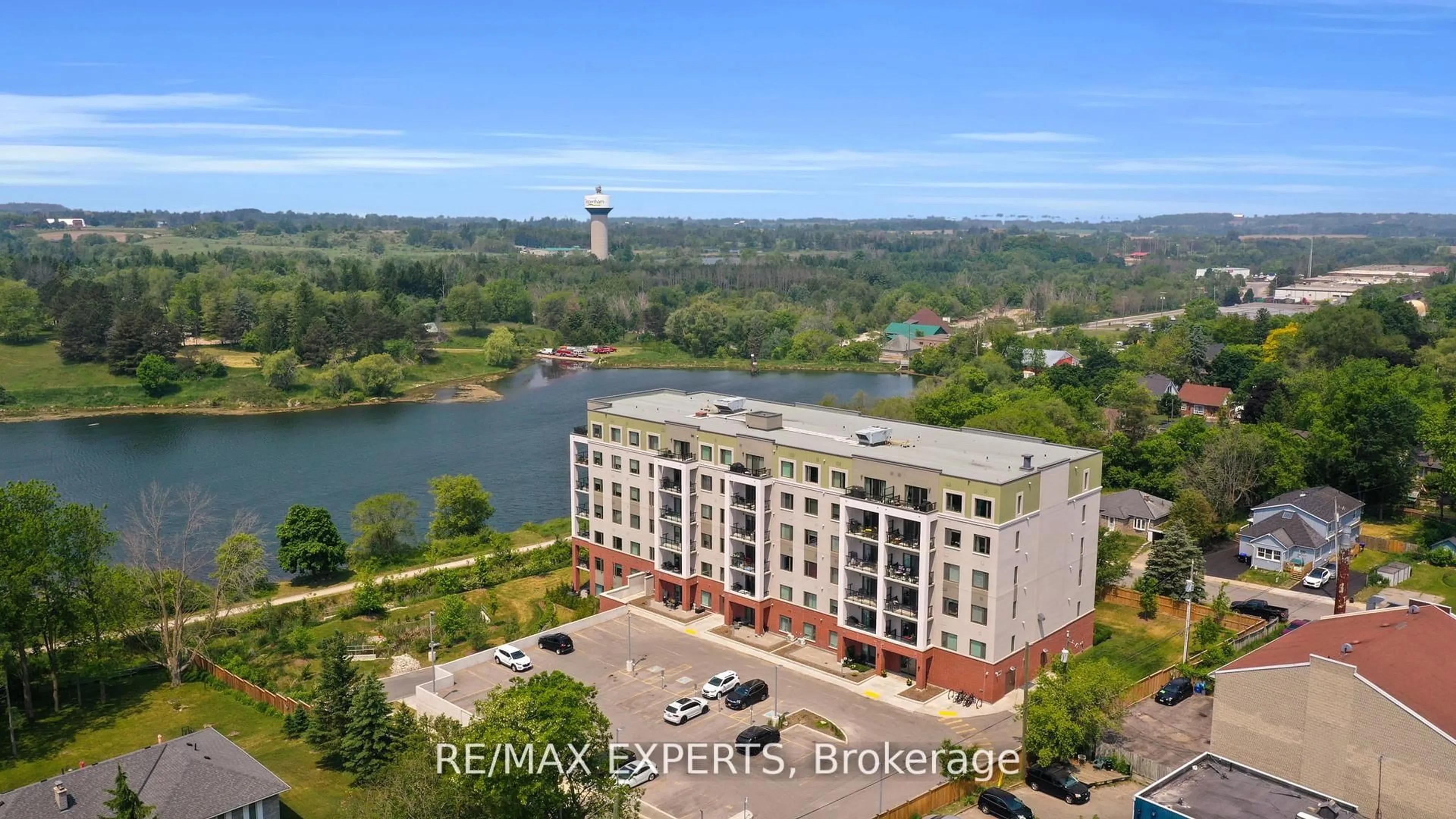 A pic from outside/outdoor area/front of a property/back of a property/a pic from drone, water/lake/river/ocean view for 64 Queen St #205, New Tecumseth Ontario L0G 1W0