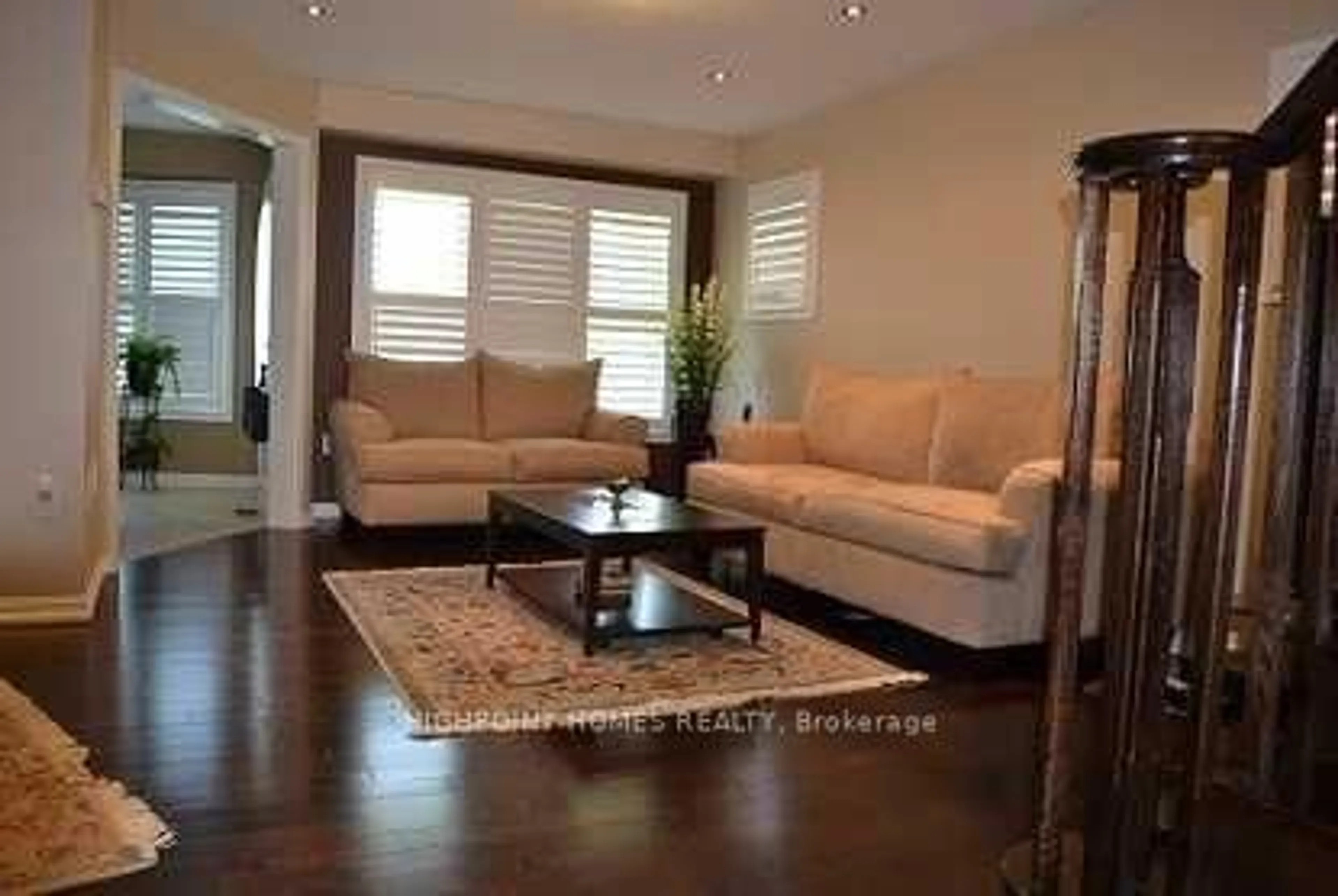 Living room with furniture, wood/laminate floor for 174 Miltrose Cres, Whitchurch-Stouffville Ontario L4A 0R3
