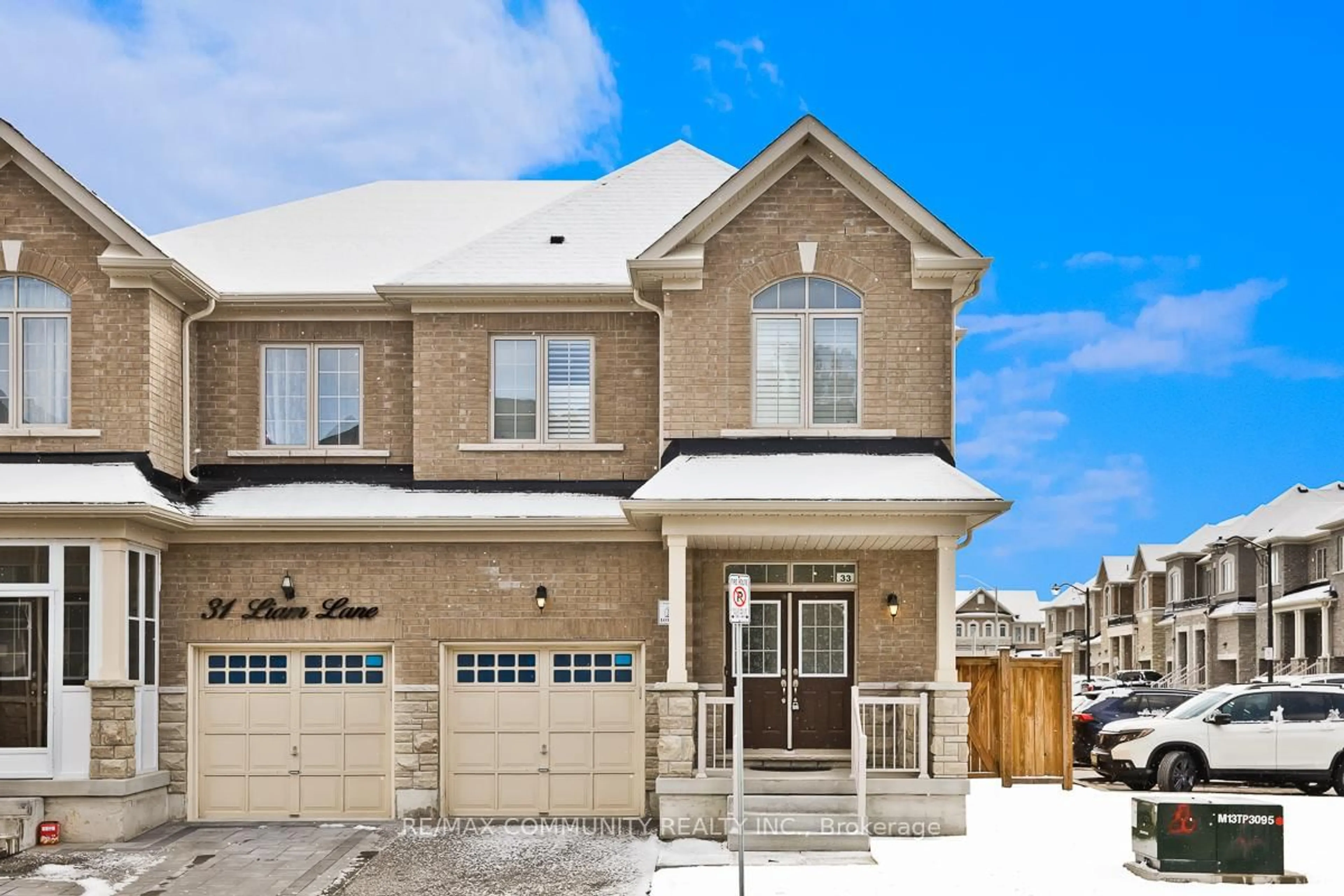 Home with brick exterior material, street for 33 Liam Lane, Markham Ontario L3S 3J5