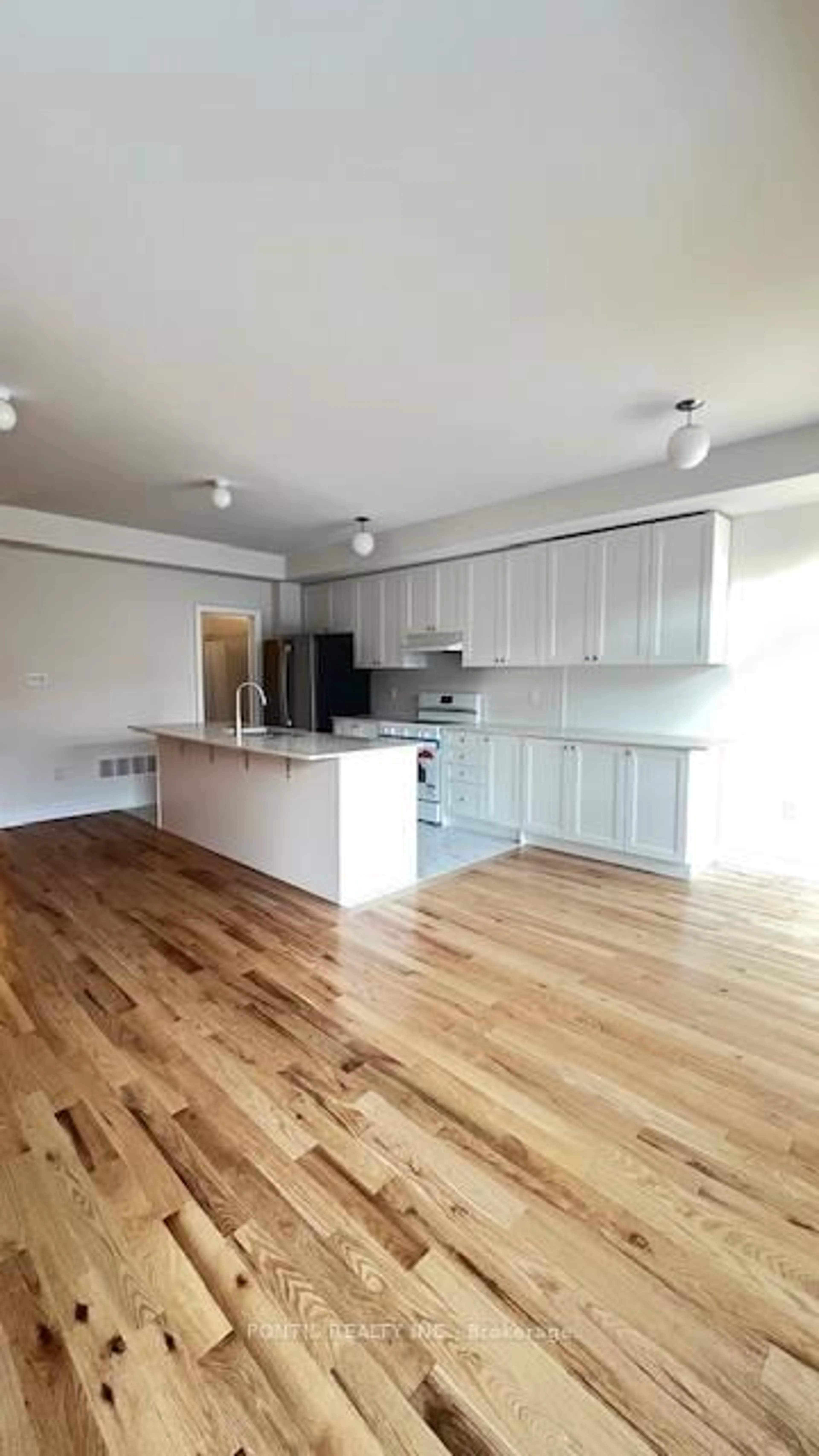 Open concept kitchen, wood/laminate floor for 221 Tennant Circ, Vaughan Ontario L4H 5L4