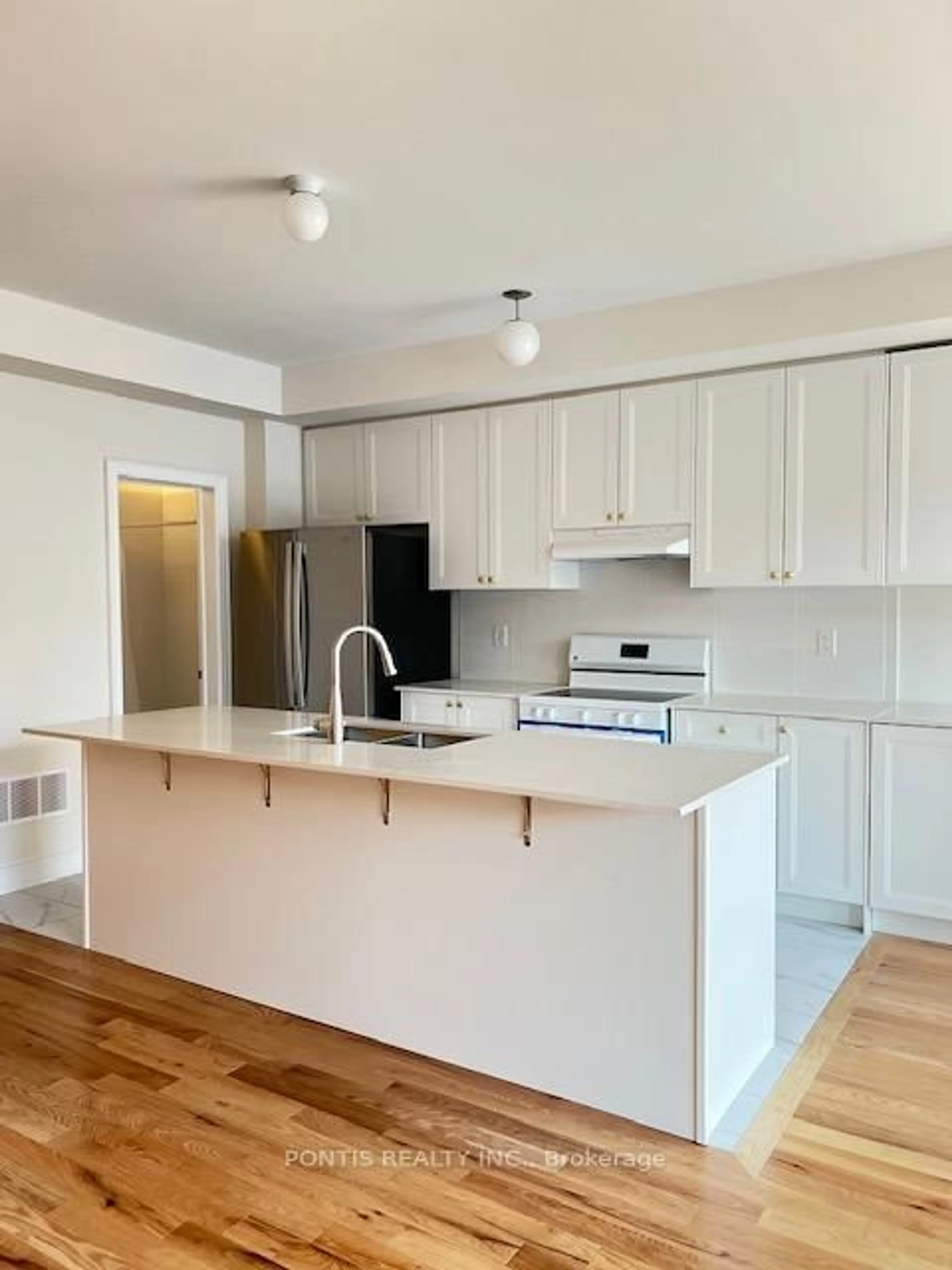 Open concept kitchen, wood/laminate floor for 221 Tennant Circ, Vaughan Ontario L4H 5L4