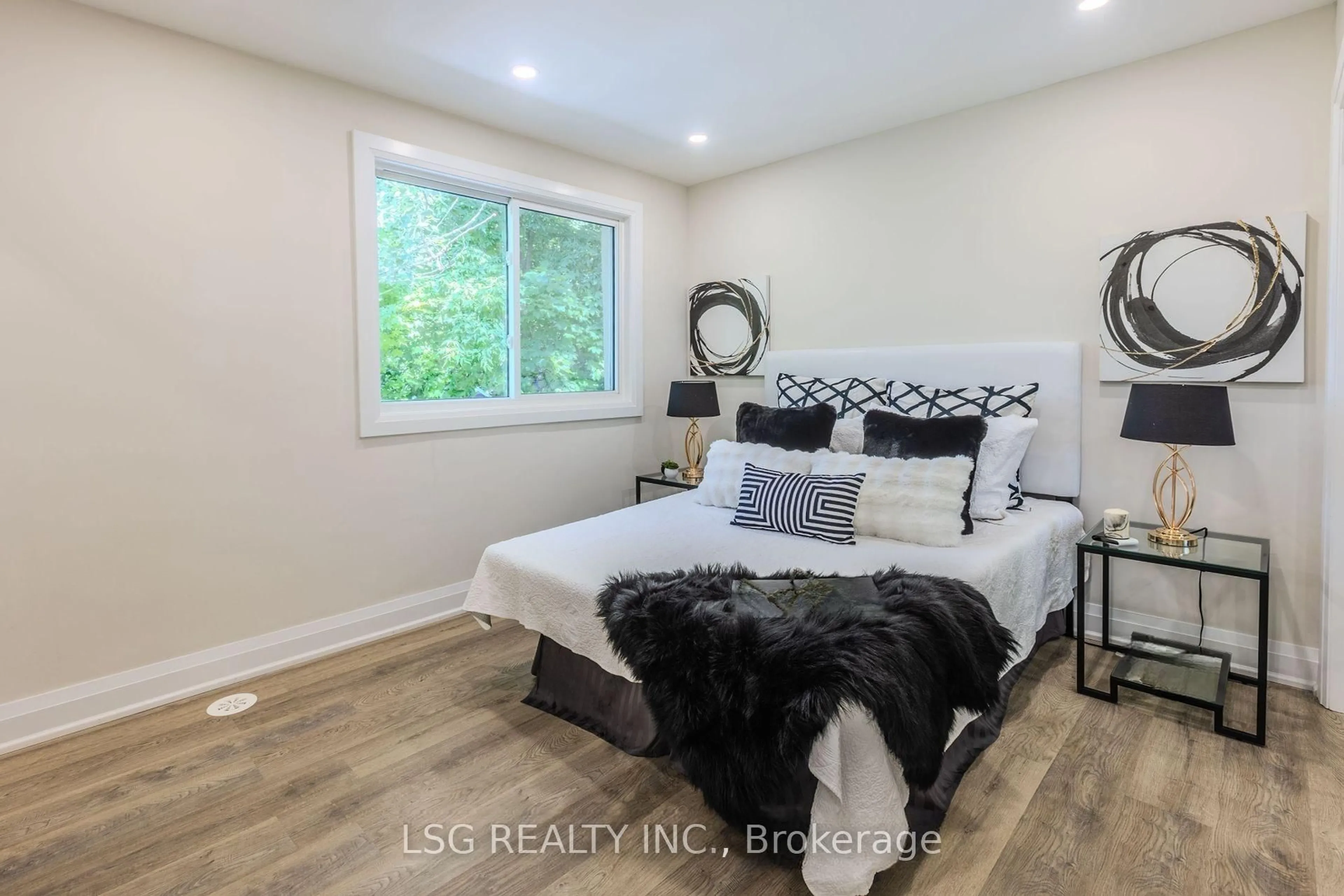 Bedroom with bed, wood/laminate floor for 56 Millard Ave, Newmarket Ontario L3Y 1Y8