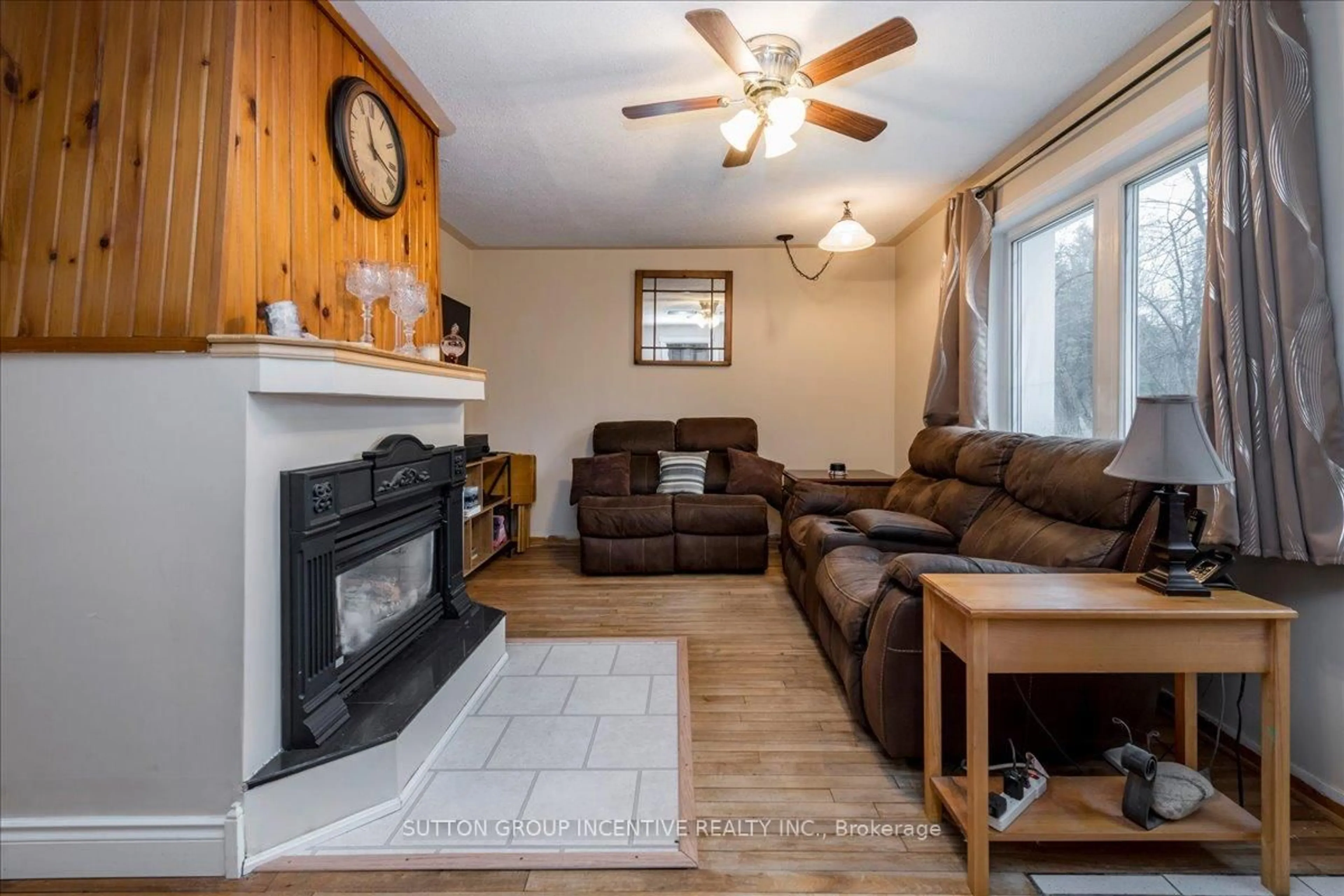 Living room with furniture, wood/laminate floor for 8993 5th Line, Essa Ontario L3W 0C7