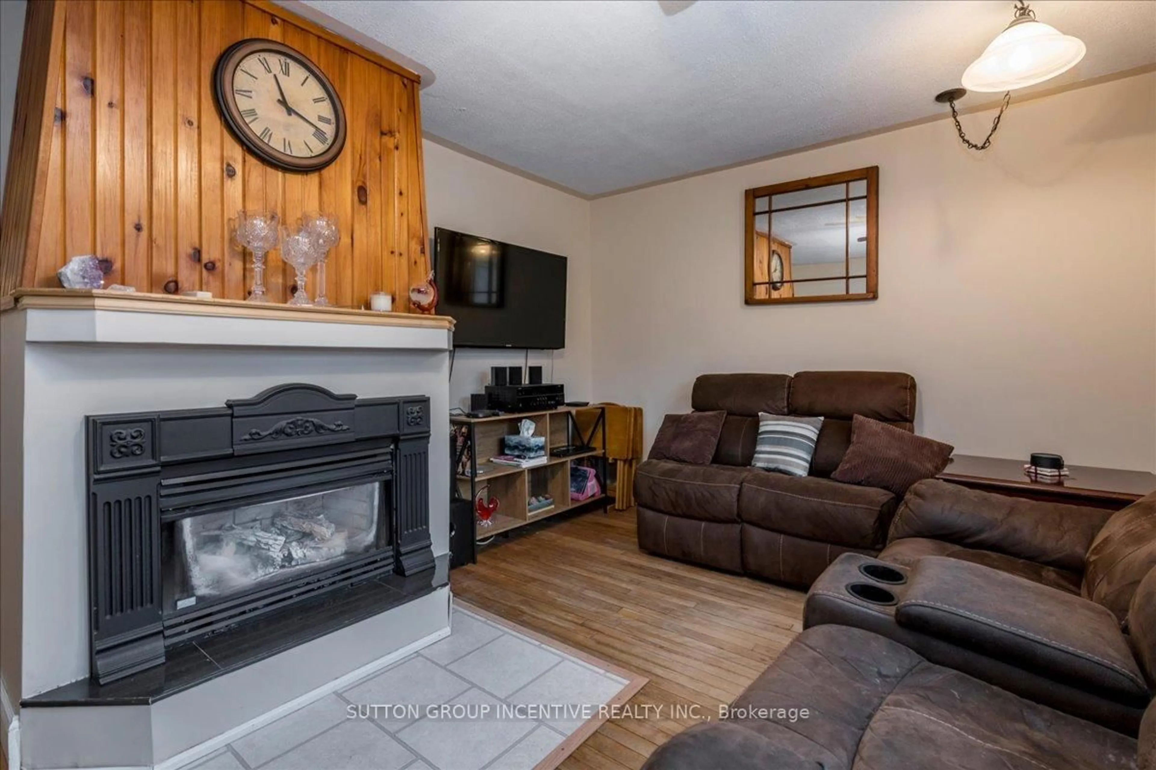 Living room with furniture, wood/laminate floor for 8993 5th Line, Essa Ontario L3W 0C7