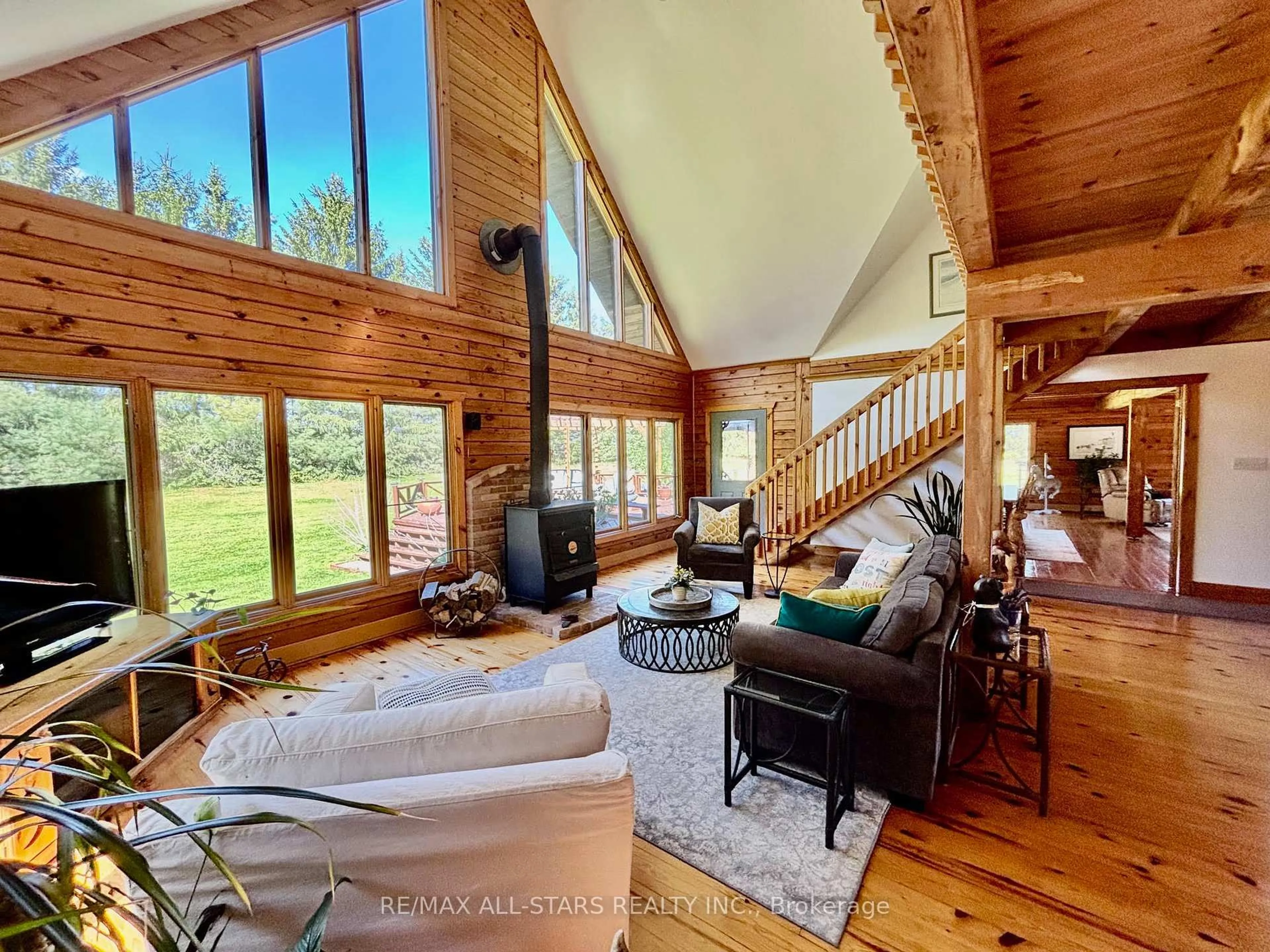 Living room with furniture, wood/laminate floor for 11590 17th Sdrd, Brock Ontario L0C 1H0