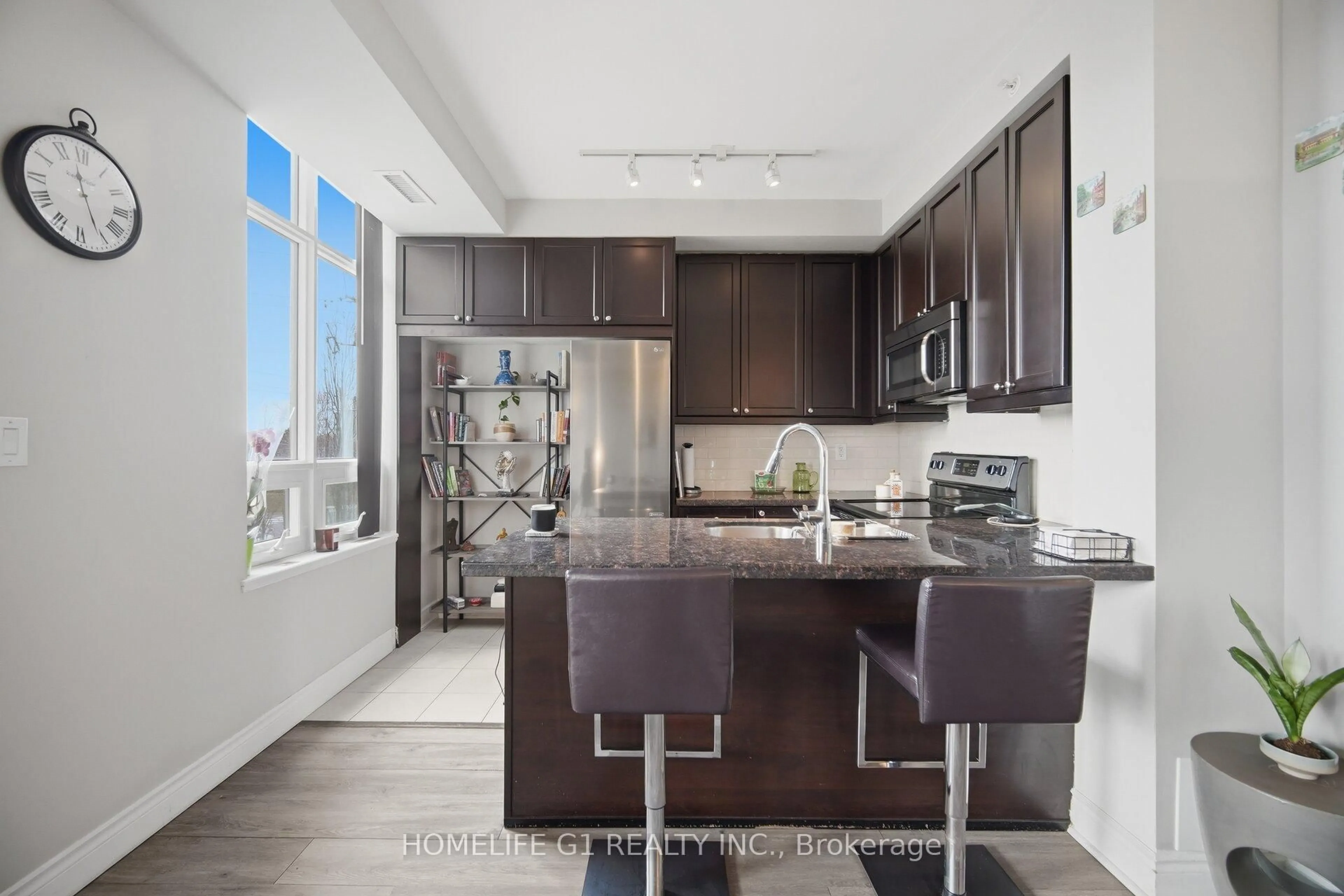 Open concept kitchen, ceramic/tile floor for 2396 Major Mackenzie Dr #212, Vaughan Ontario L6A 3Y7