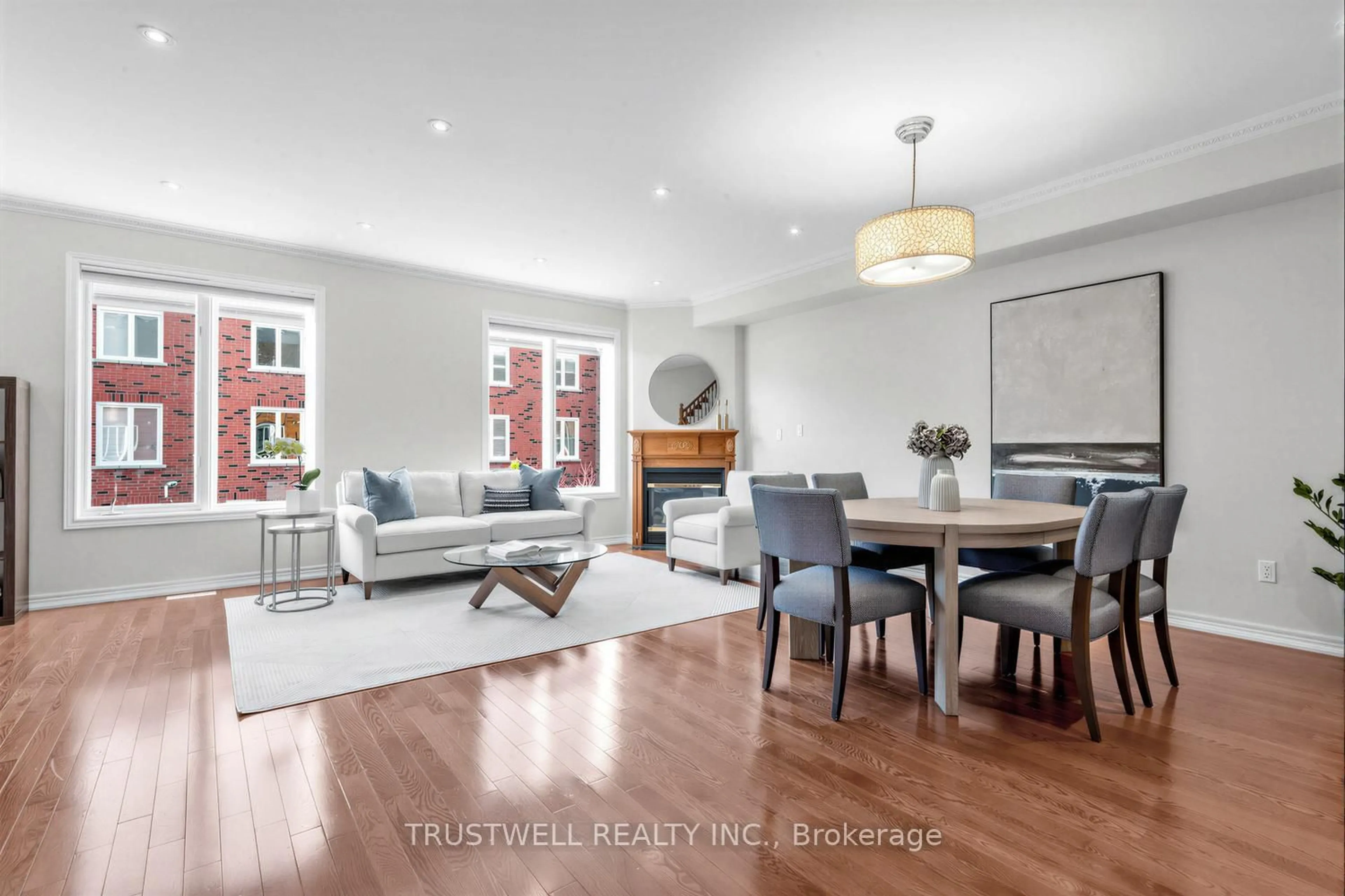 Living room with furniture, wood/laminate floor for 32 Orchid Rd, Markham Ontario L3T 7T6