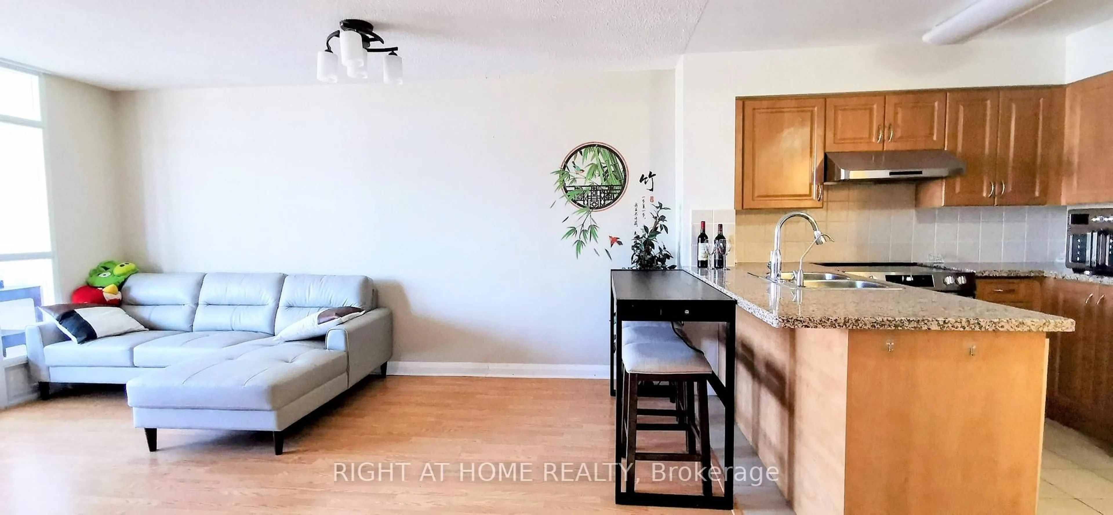 Open concept kitchen, wood/laminate floor for 7363 Kennedy Rd #613, Markham Ontario L3R 1G8