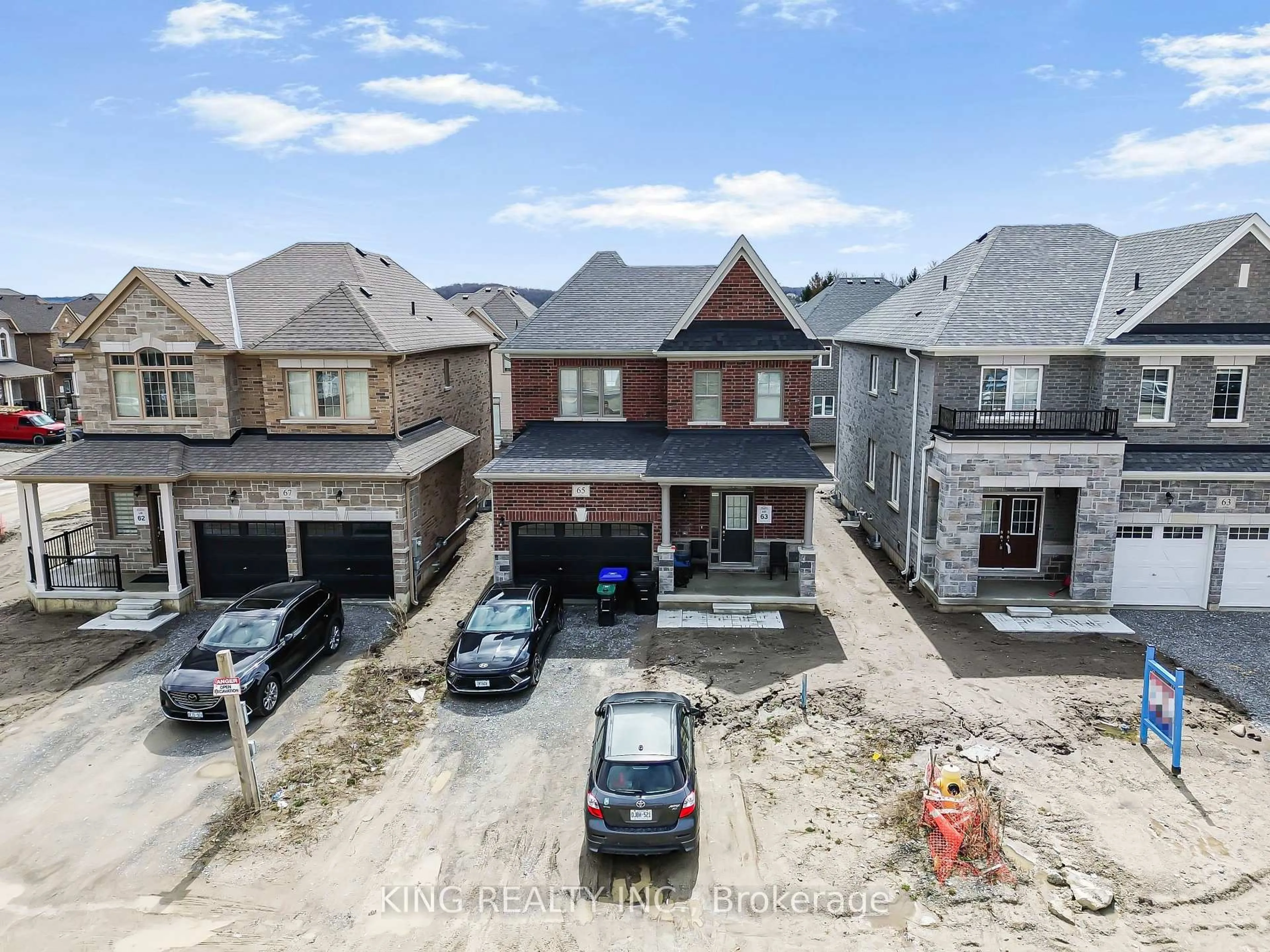 A pic from outside/outdoor area/front of a property/back of a property/a pic from drone, street for 65 English Dr, New Tecumseth Ontario L0G 1A0