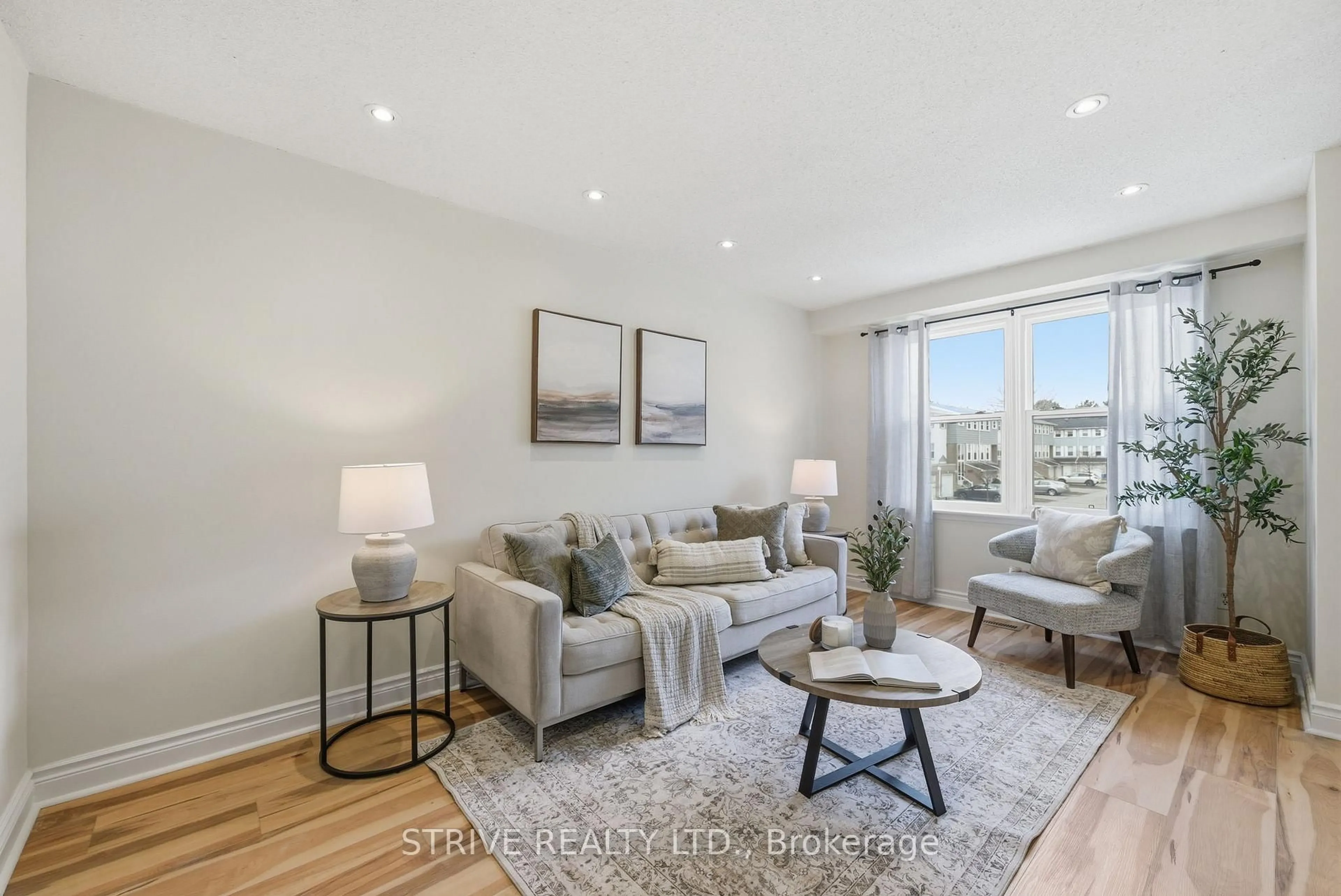 Living room with furniture, wood/laminate floor for 1718 John St, Markham Ontario L3T 1Y9