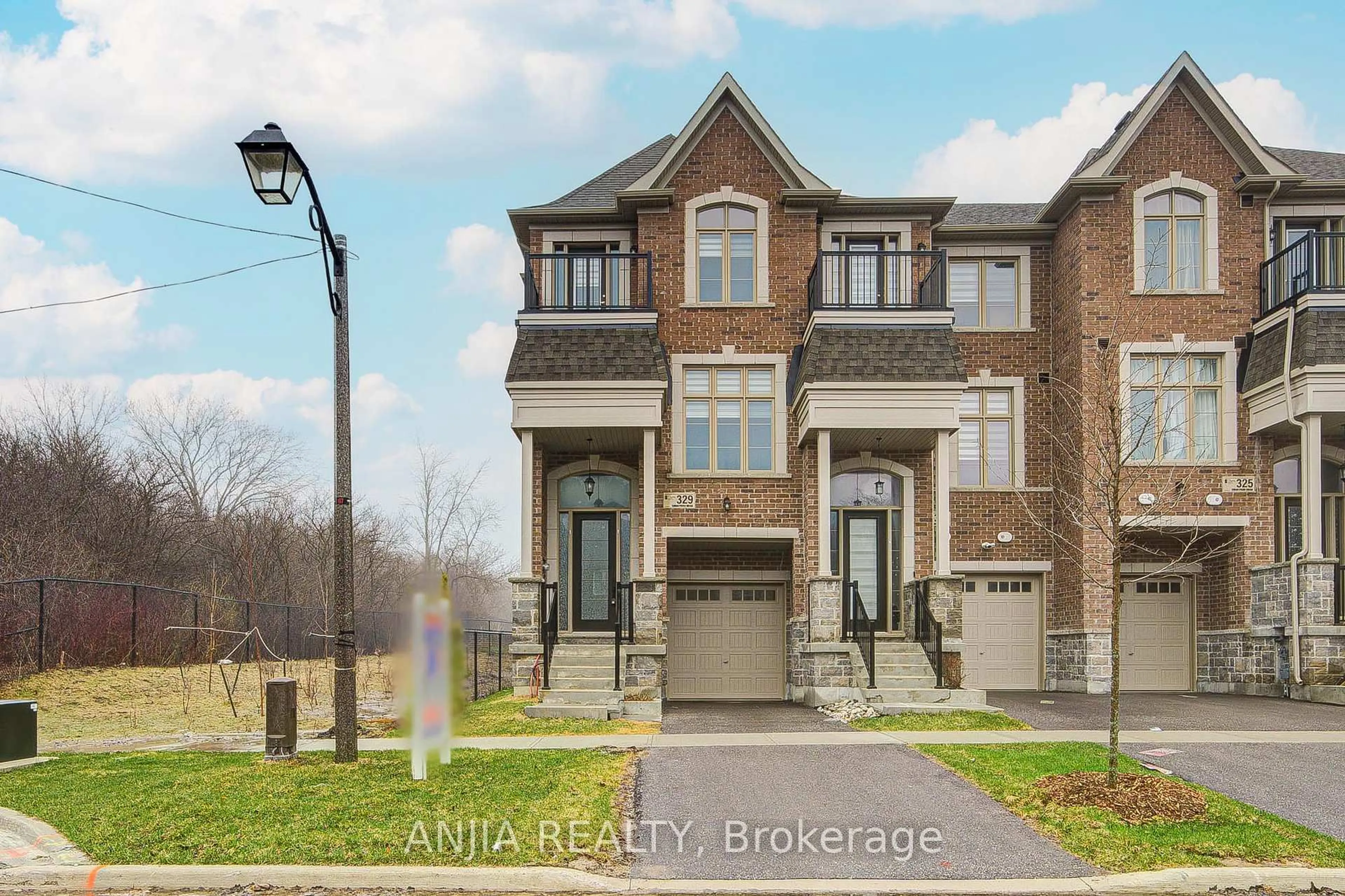 Home with brick exterior material, street for 329 Swan Park Rd, Markham Ontario L6E 0H5