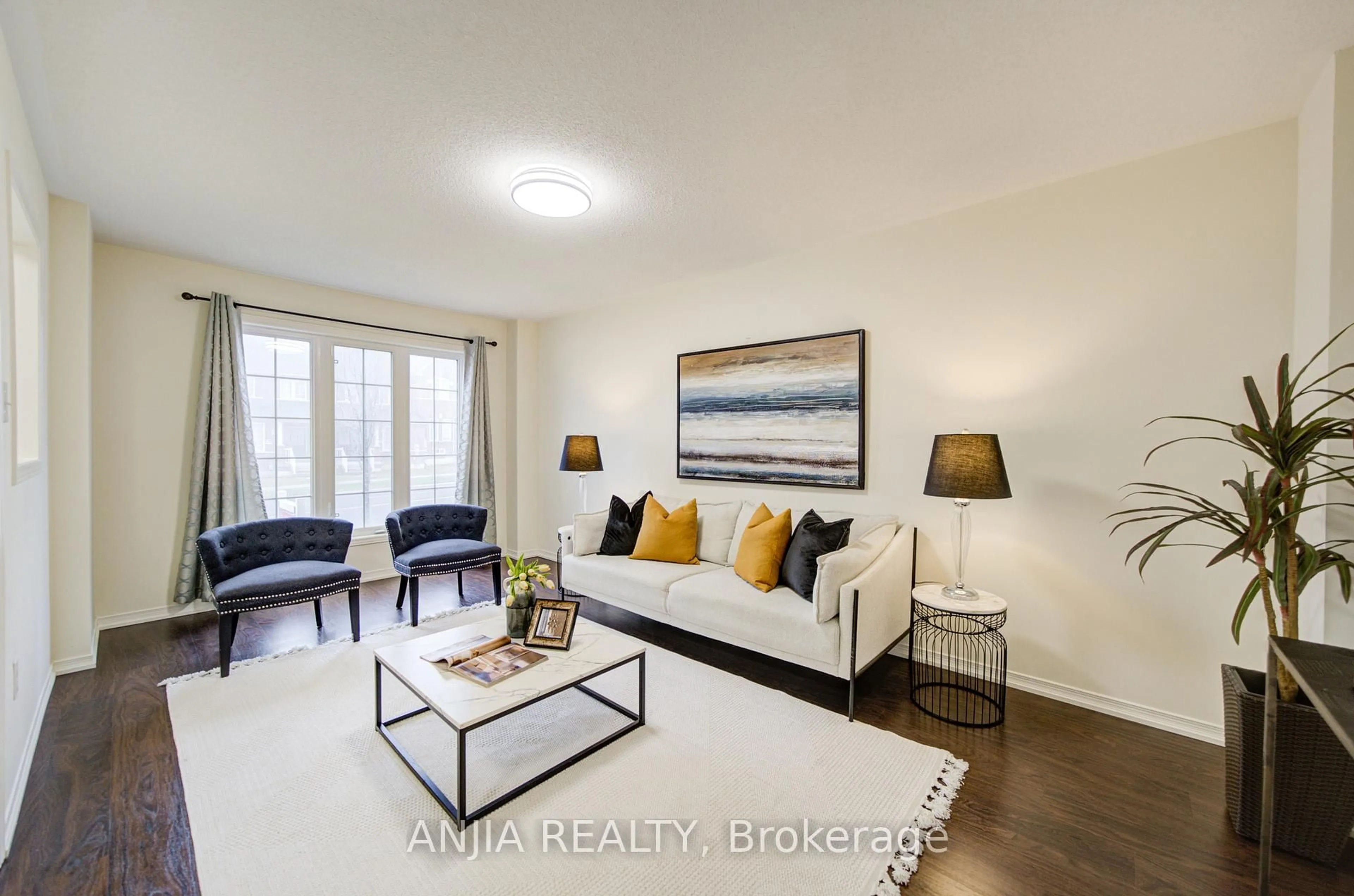 Living room with furniture, wood/laminate floor for 1124 Bur Oak Ave, Markham Ontario L6E 0K9