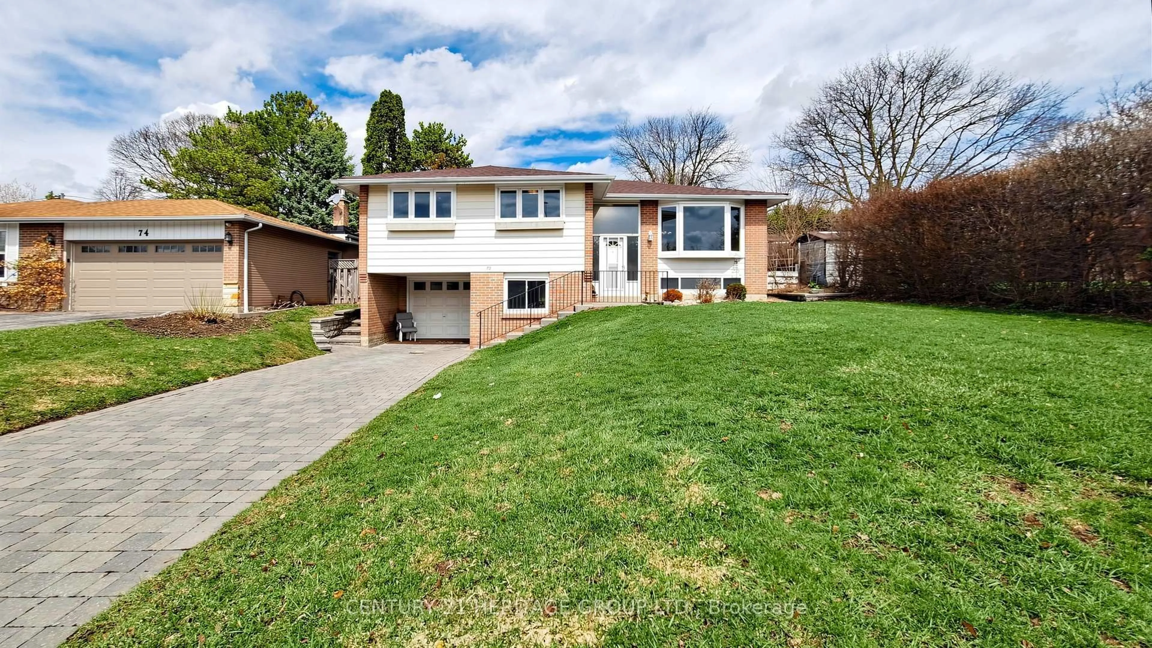 Home with brick exterior material, street for 72 Romfield Crct, Markham Ontario L3T 3H6