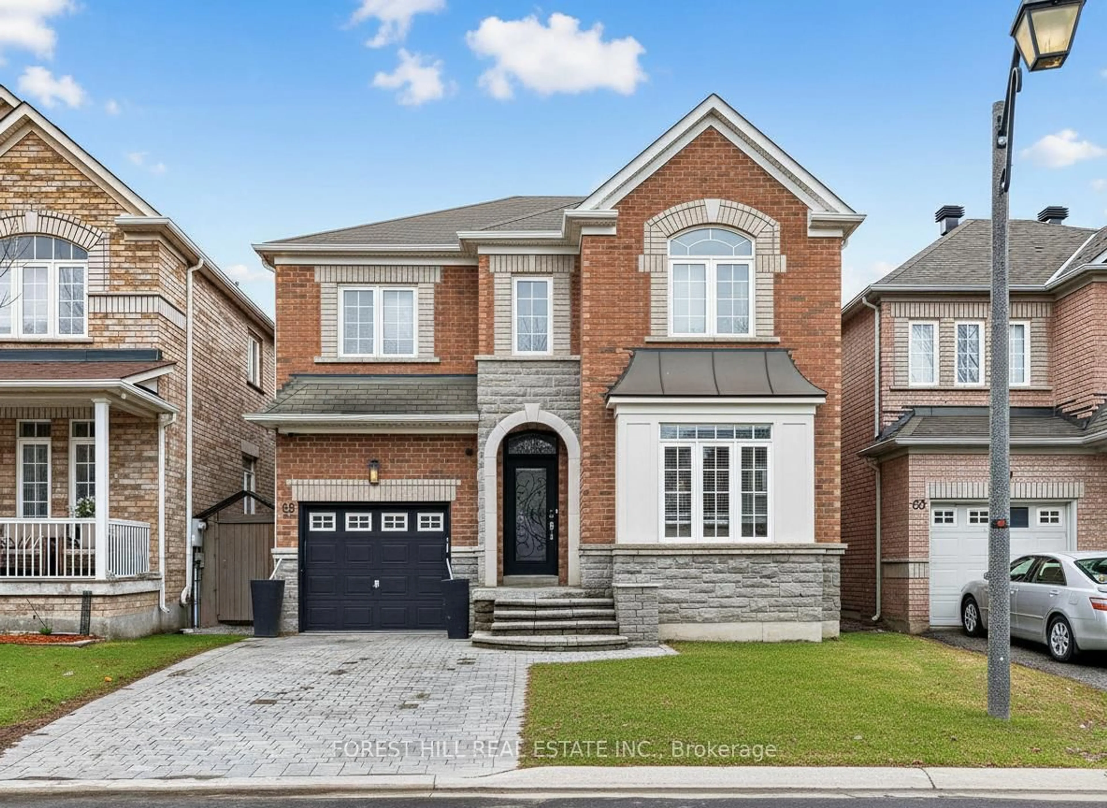 Home with brick exterior material, street for 65 Victoria Wood Ave, Markham Ontario L6E 1K2