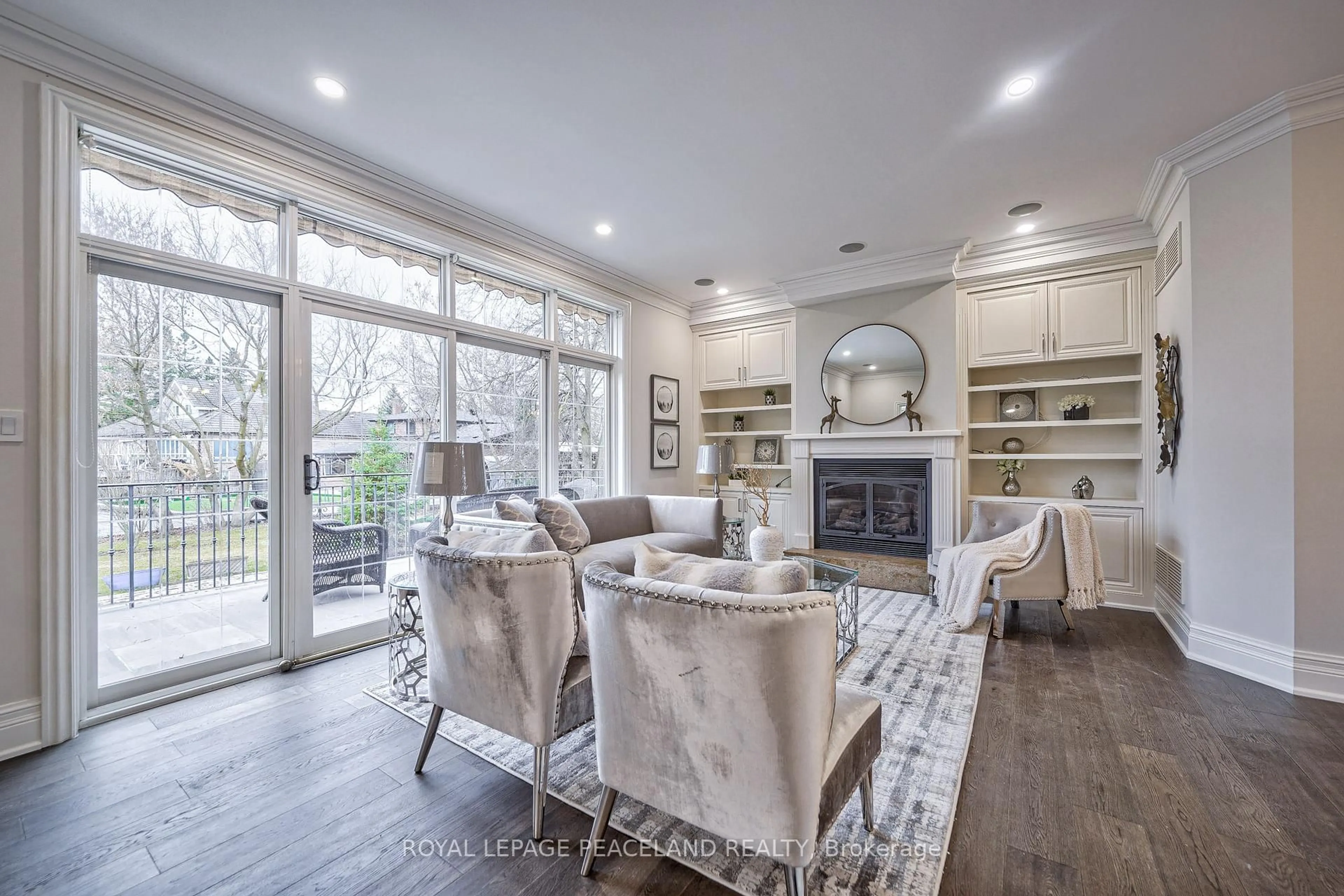 Living room with furniture, wood/laminate floor for 3 River Bend Rd, Markham Ontario L3R 1K3