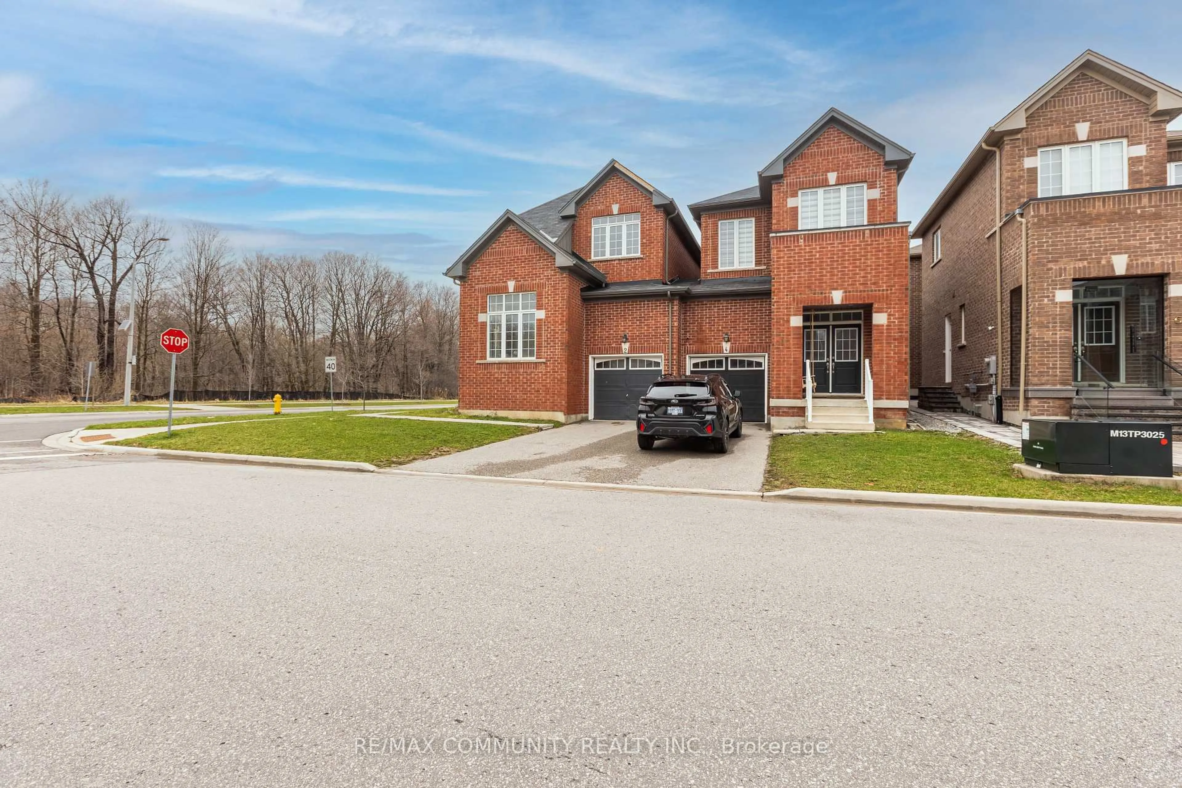 Home with brick exterior material, street for 2 Titan Tr, Markham Ontario L3S 0E2