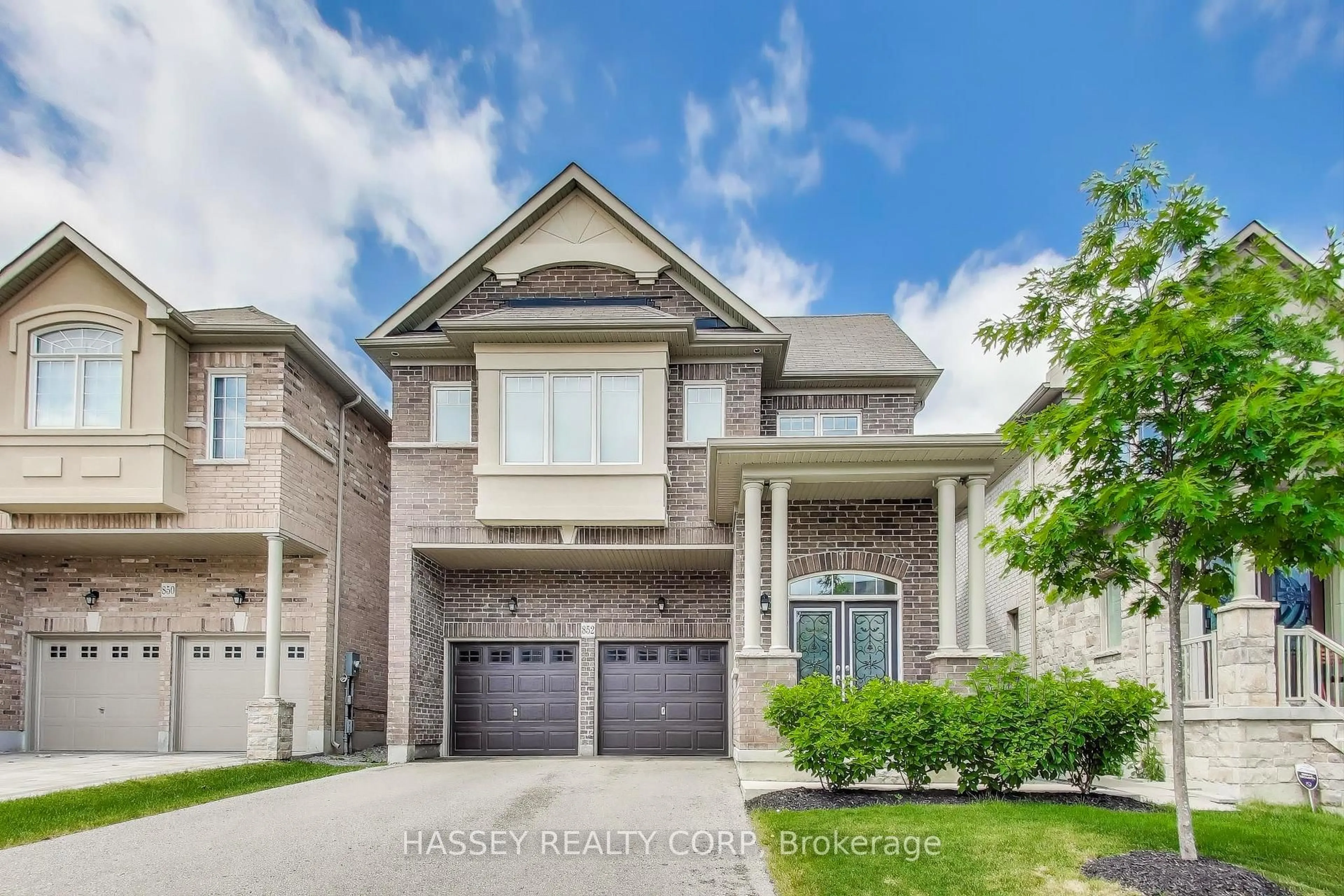 Home with brick exterior material, street for 852 Elvidge Tr, Newmarket Ontario L3X 0J7