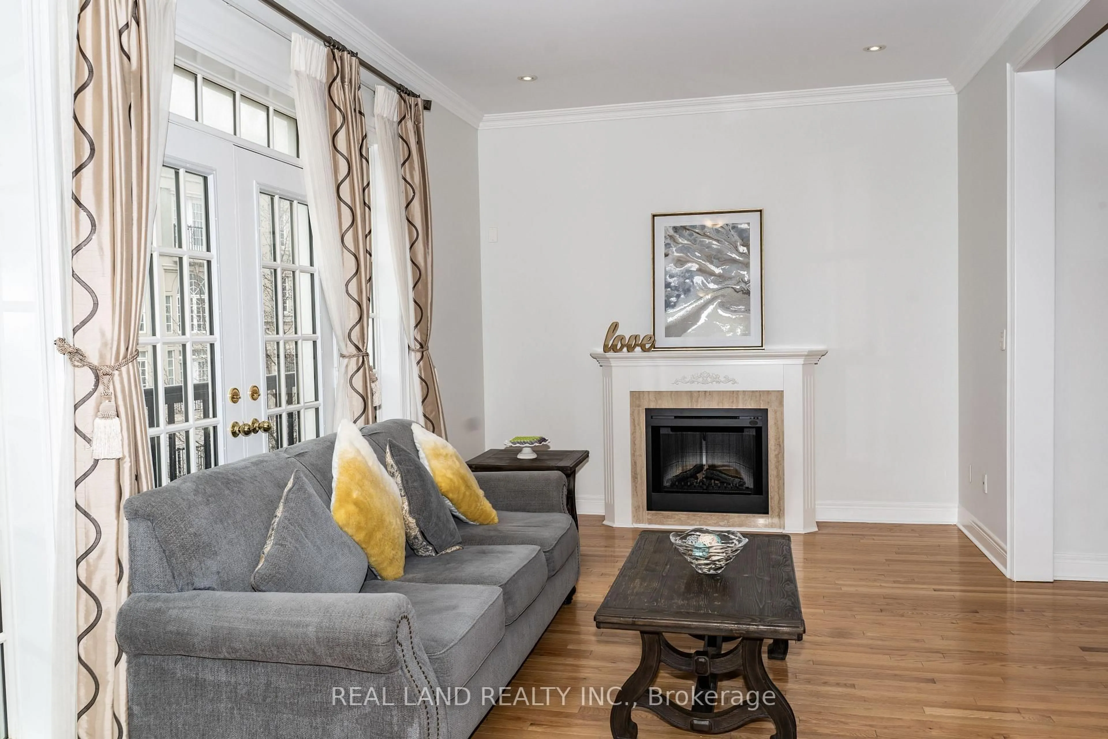 Living room with furniture, wood/laminate floor for 41 Lord Durham Rd, Markham Ontario L6G 0C2