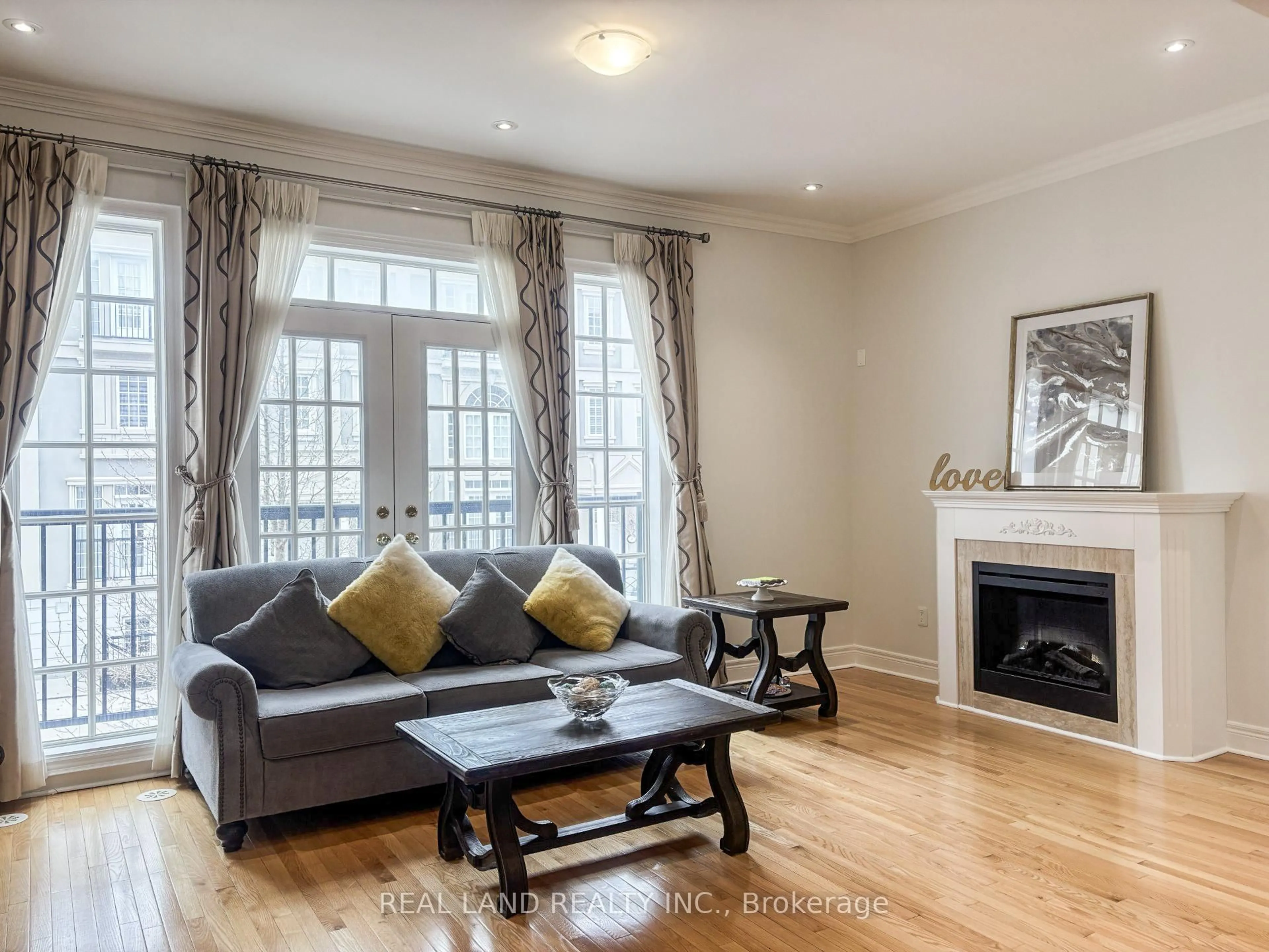 Living room with furniture, wood/laminate floor for 41 Lord Durham Rd, Markham Ontario L6G 0C2