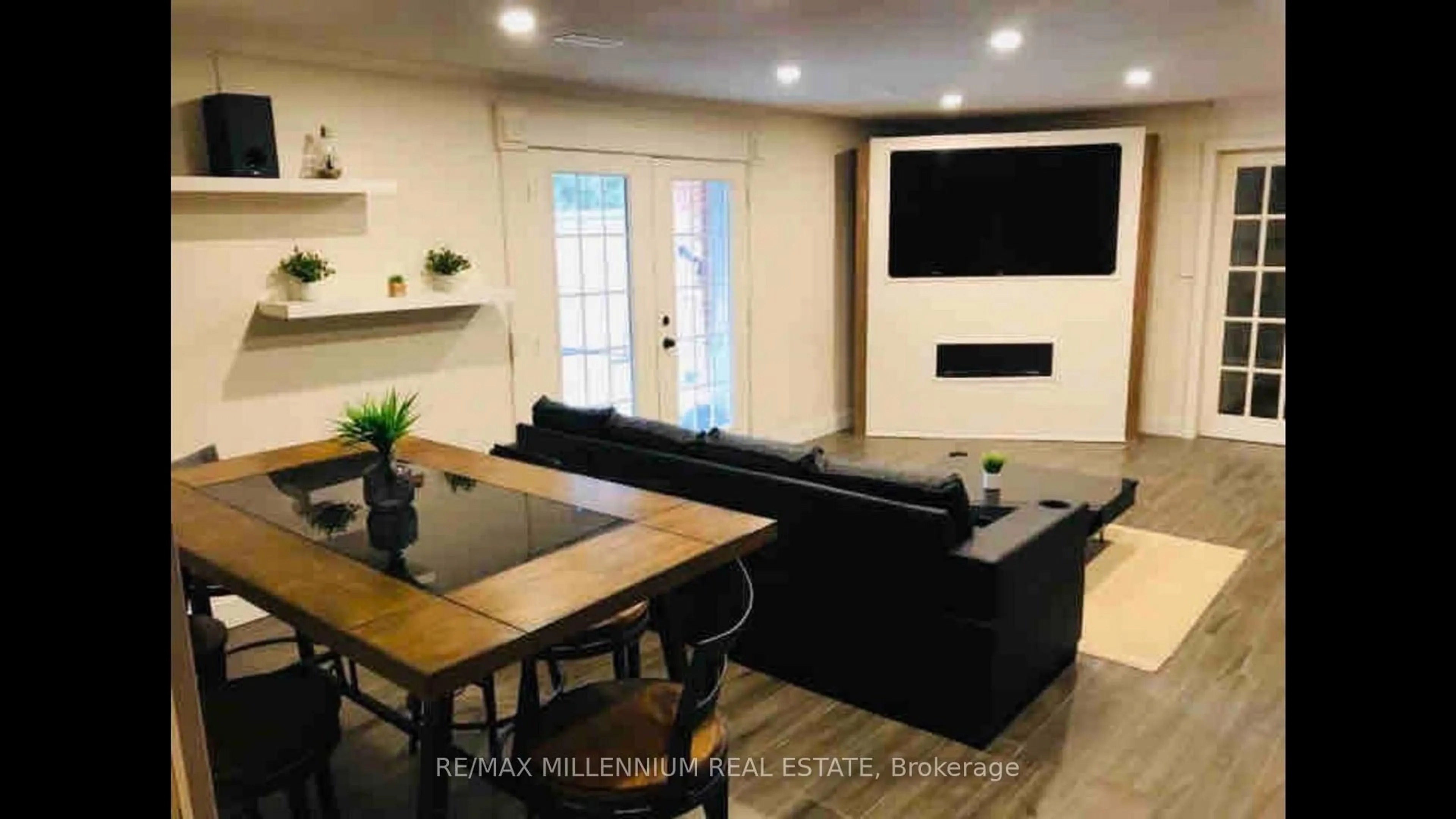 Living room with furniture, wood/laminate floor for 2831 County Rd #89, Innisfil Ontario L0L 1L0