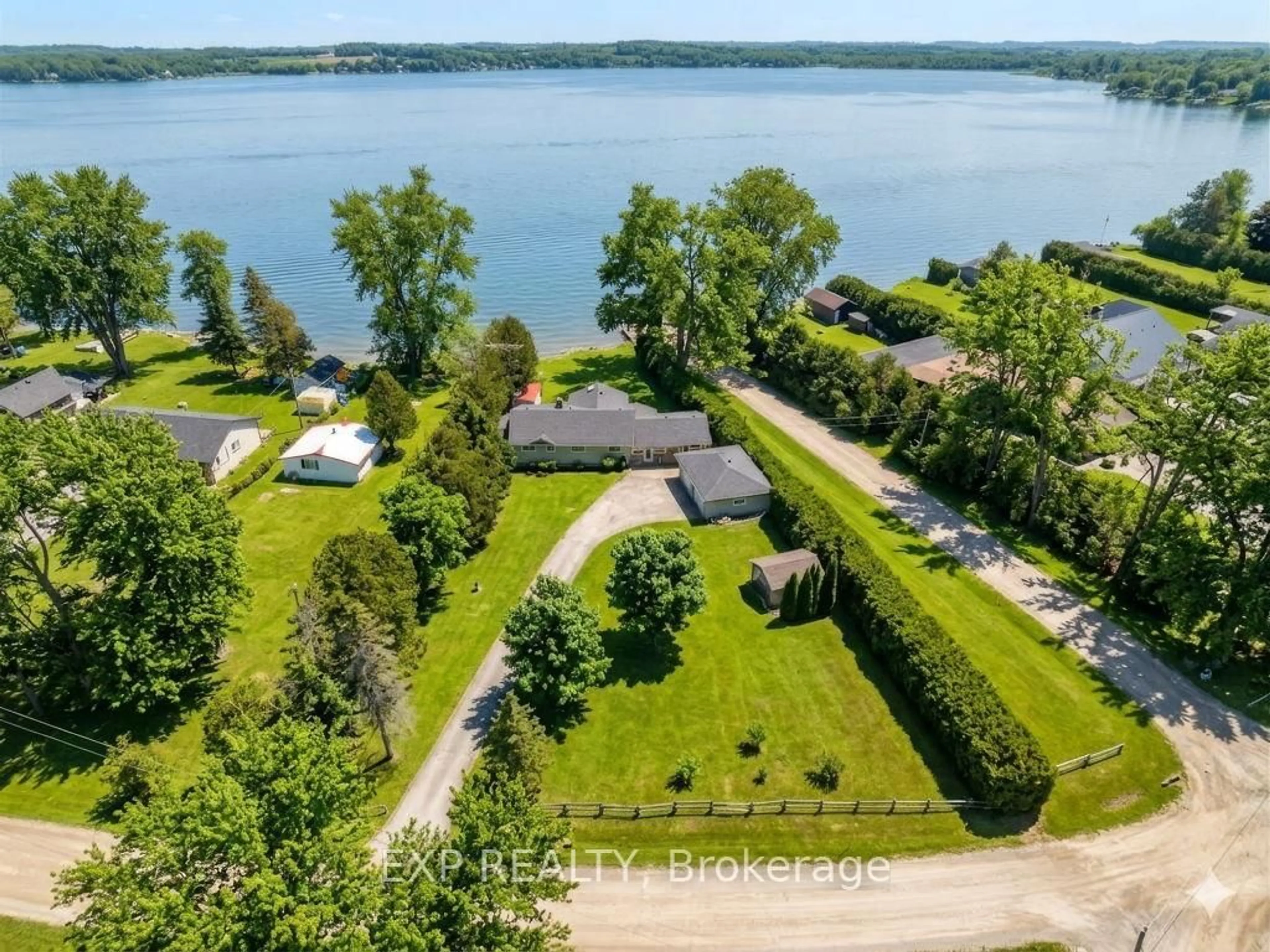 A pic from outside/outdoor area/front of a property/back of a property/a pic from drone, water/lake/river/ocean view for 561 Duclos Point Rd, Georgina Ontario L0E 1N0
