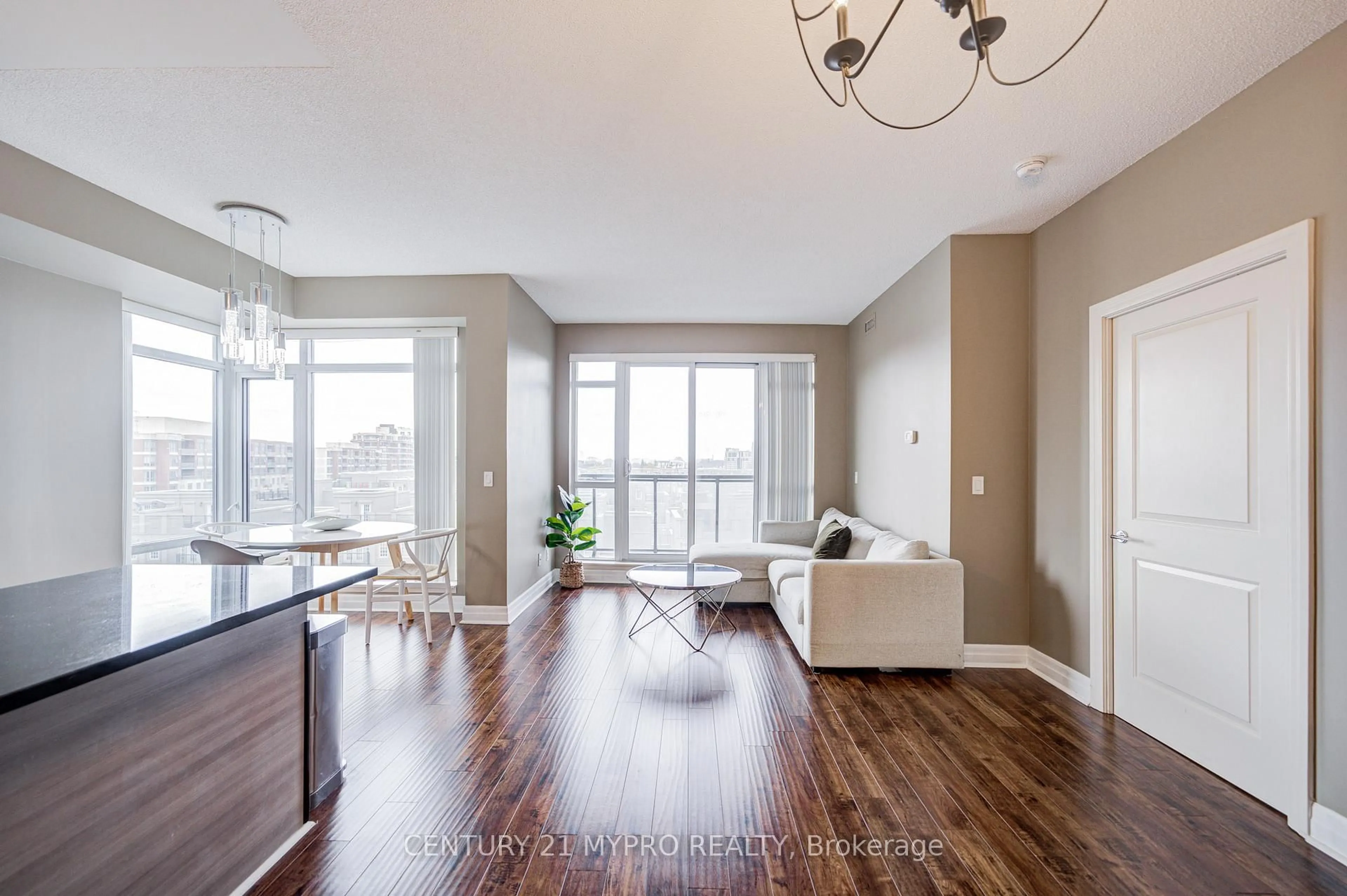 Living room with furniture, wood/laminate floor for 8130 Birchmount Rd #615, Markham Ontario L6G 0E4