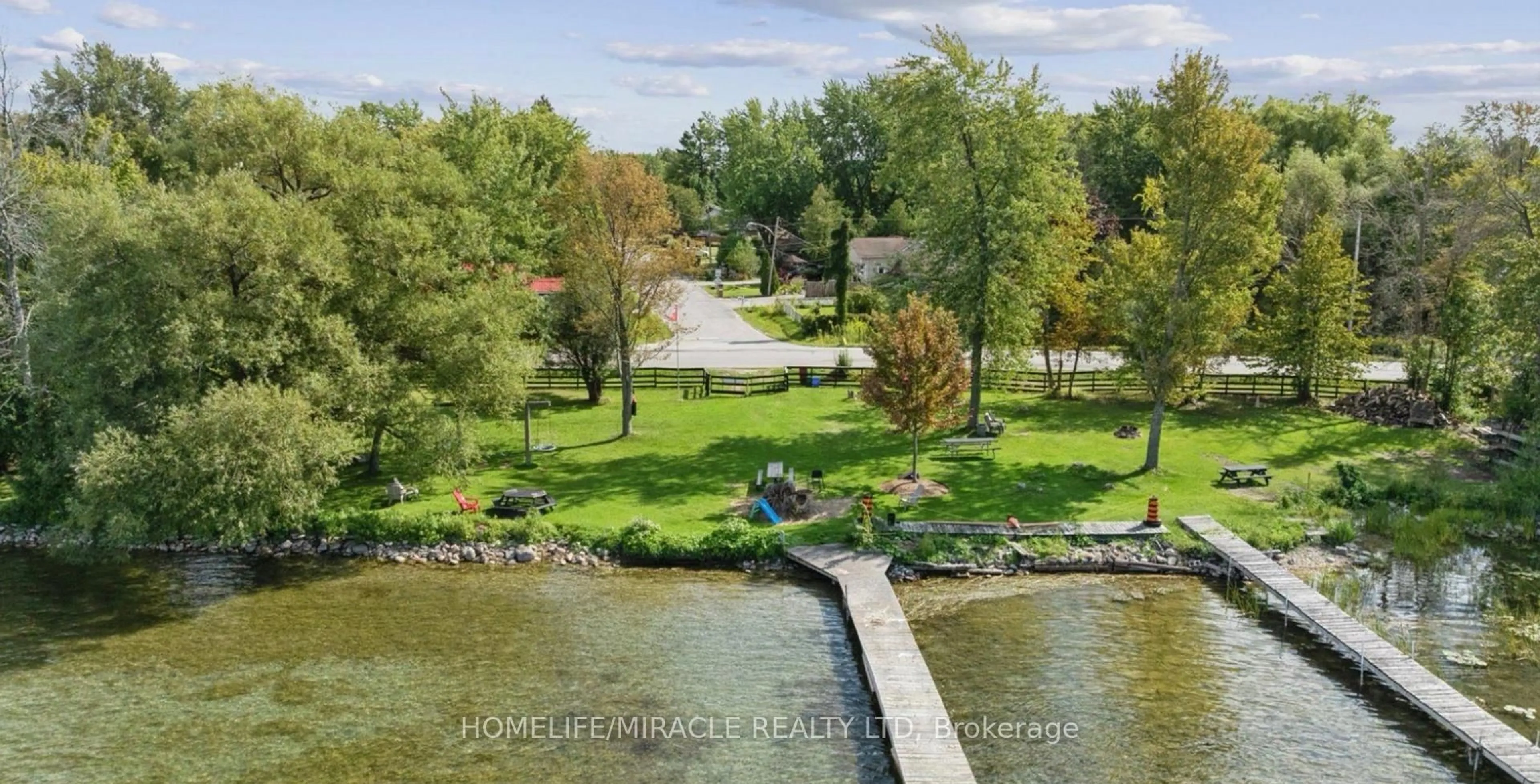 A pic from outside/outdoor area/front of a property/back of a property/a pic from drone, water/lake/river/ocean view for 2 Della St, Georgina Ontario L0E 1R0
