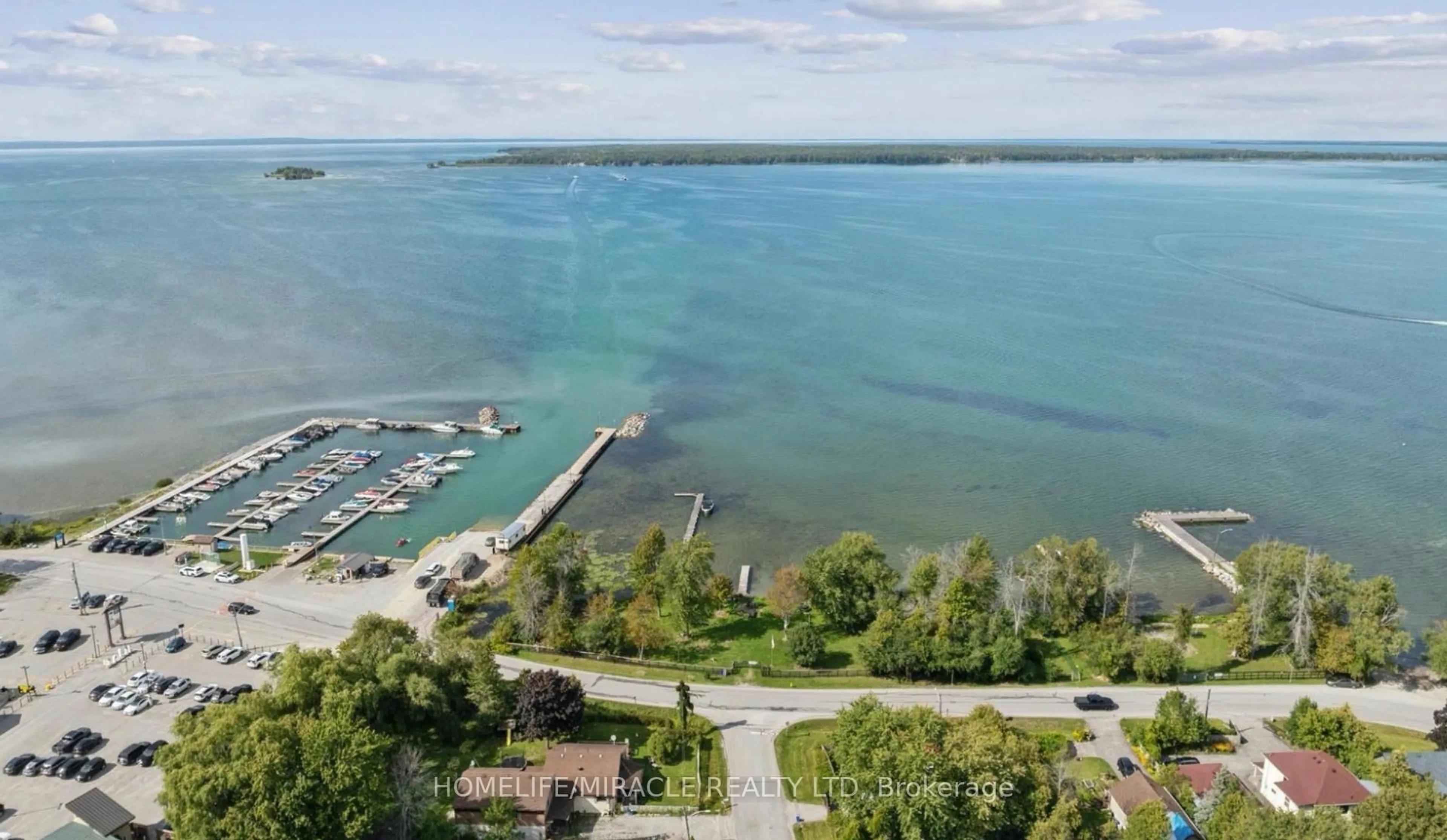 A pic from outside/outdoor area/front of a property/back of a property/a pic from drone, water/lake/river/ocean view for 2 Della St, Georgina Ontario L0E 1R0