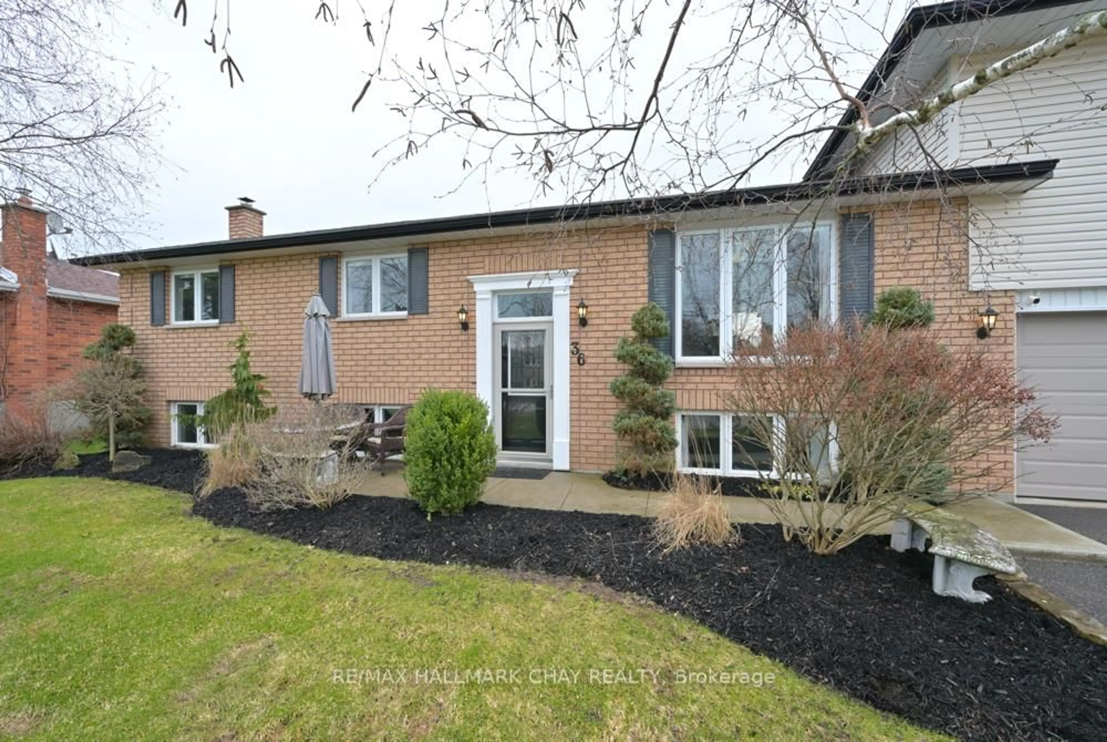 Home with brick exterior material, street for 36 Moore Ave, Adjala-Tosorontio Ontario L0M 1J0