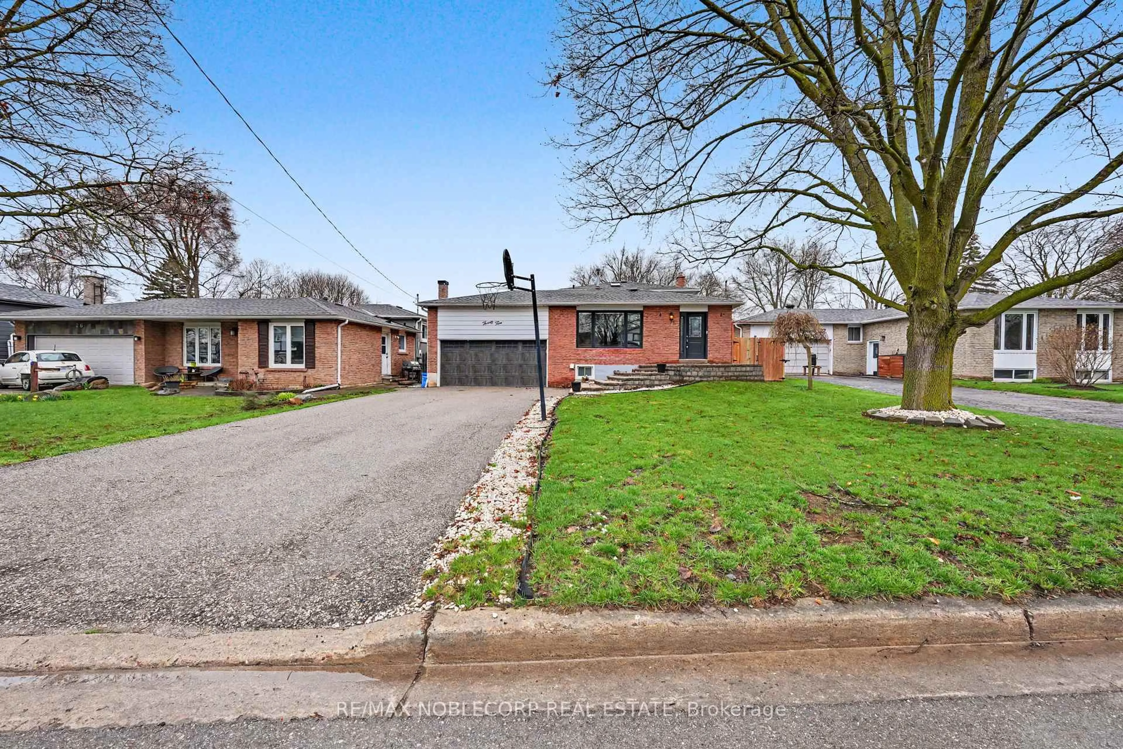 A pic from outside/outdoor area/front of a property/back of a property/a pic from drone, street for 24 Maple Ave, New Tecumseth Ontario L0G 1A0