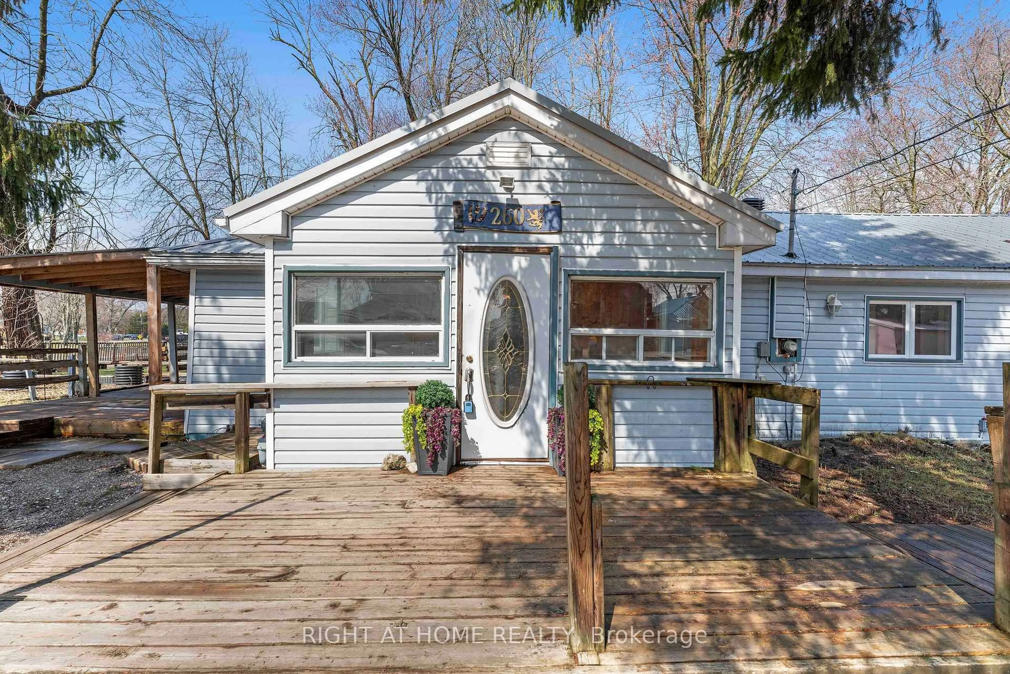 Home with vinyl exterior material, street for 260 Beach Rd, Innisfil Ontario L0L 1R0