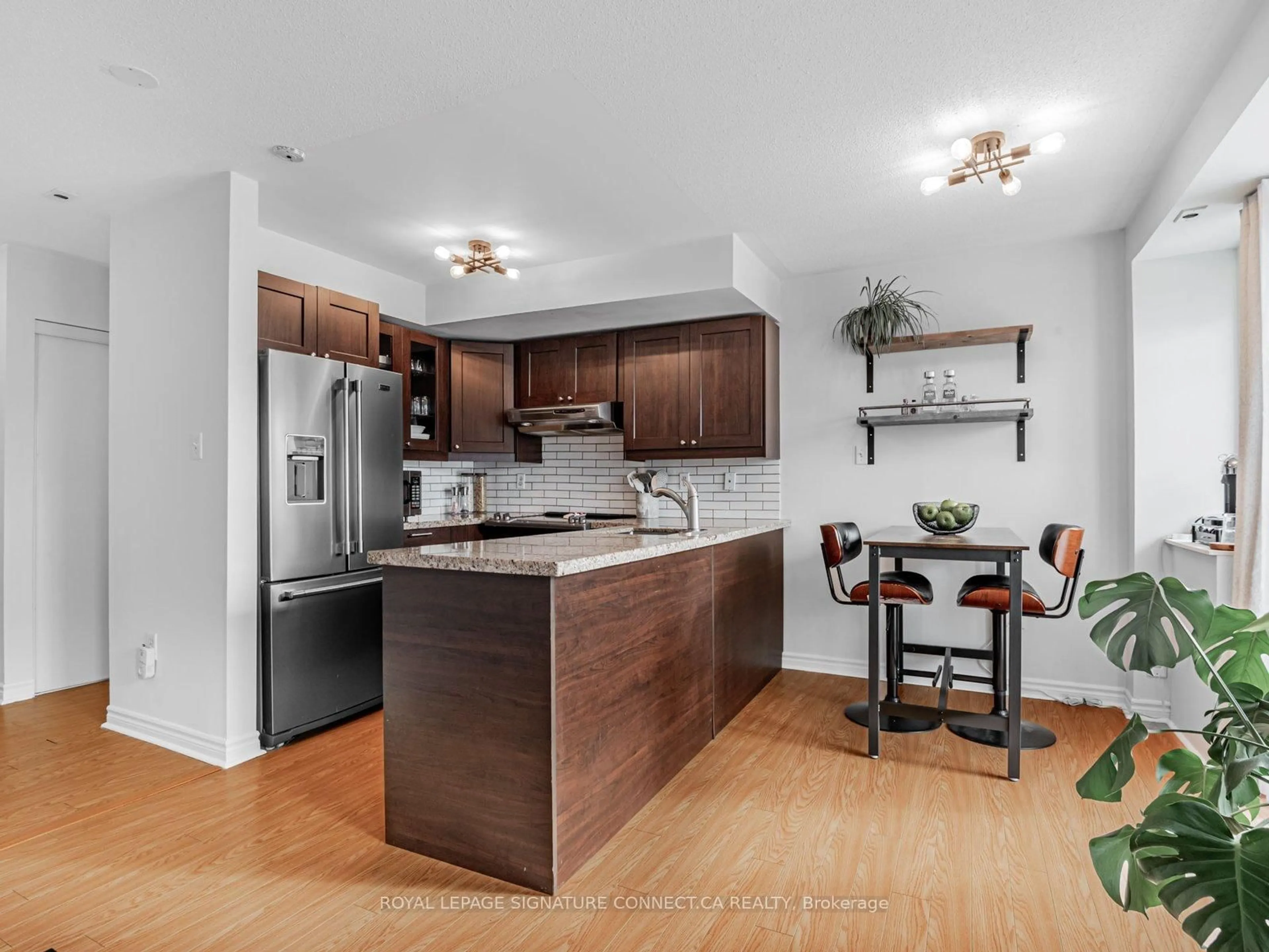 Open concept kitchen, wood/laminate floor for 110 Cornell Park Ave #C208, Markham Ontario L6B 1B6