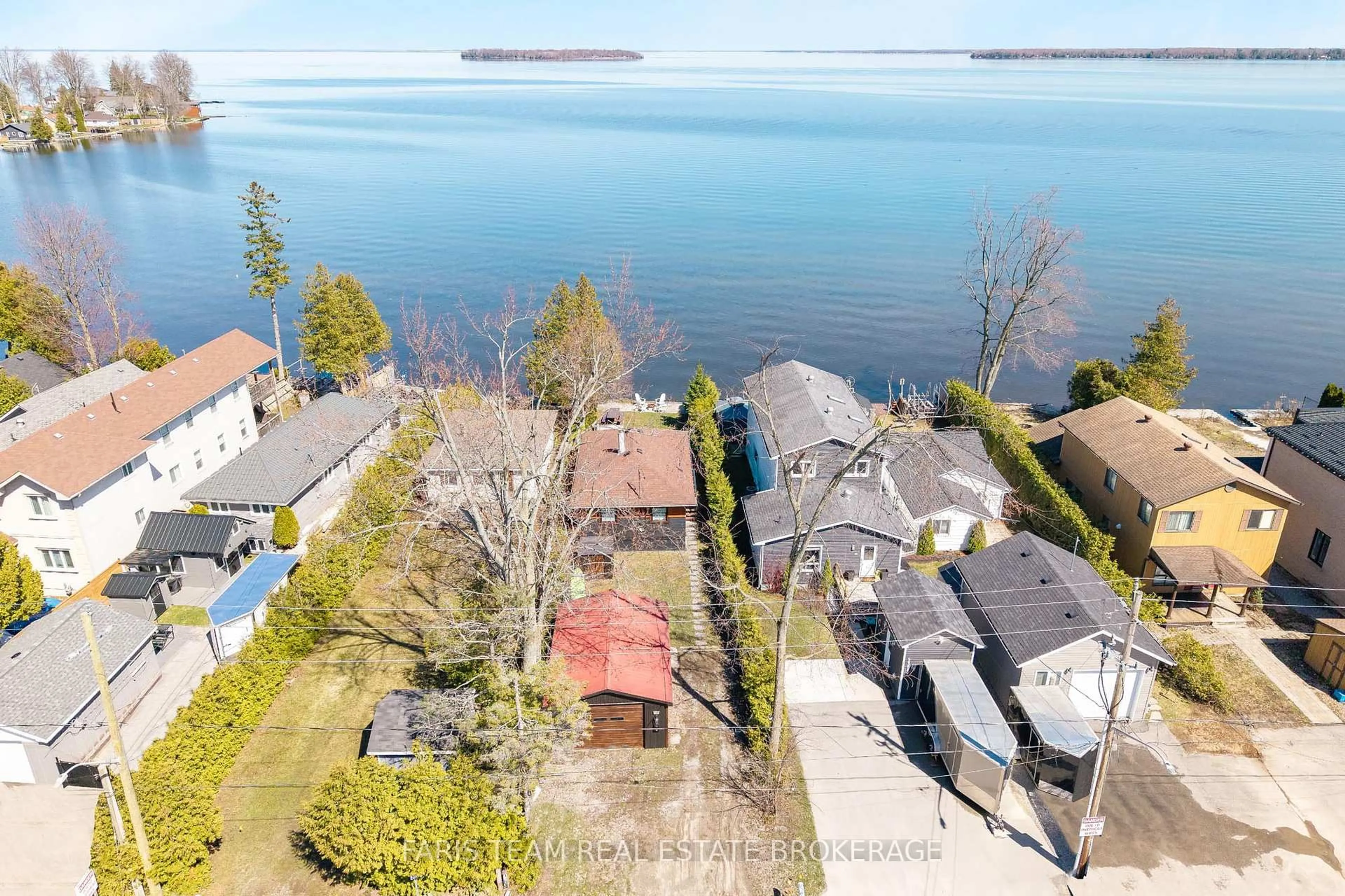 A pic from outside/outdoor area/front of a property/back of a property/a pic from drone, water/lake/river/ocean view for 2305 Crystal Beach Rd, Innisfil Ontario L9S 3W8