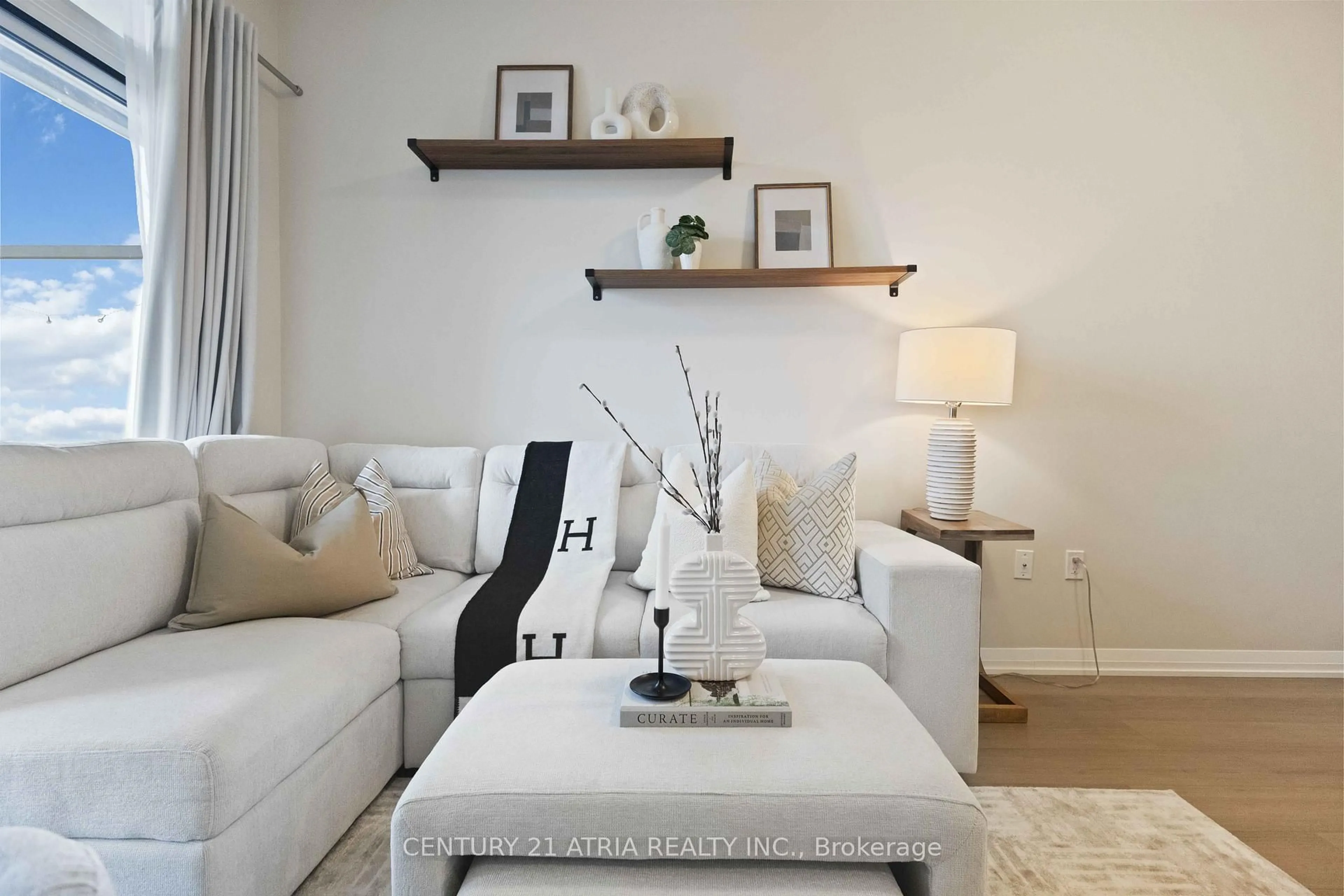 Living room with furniture, wood/laminate floor for 9560 Markham Rd #705, Markham Ontario L6E 0T9