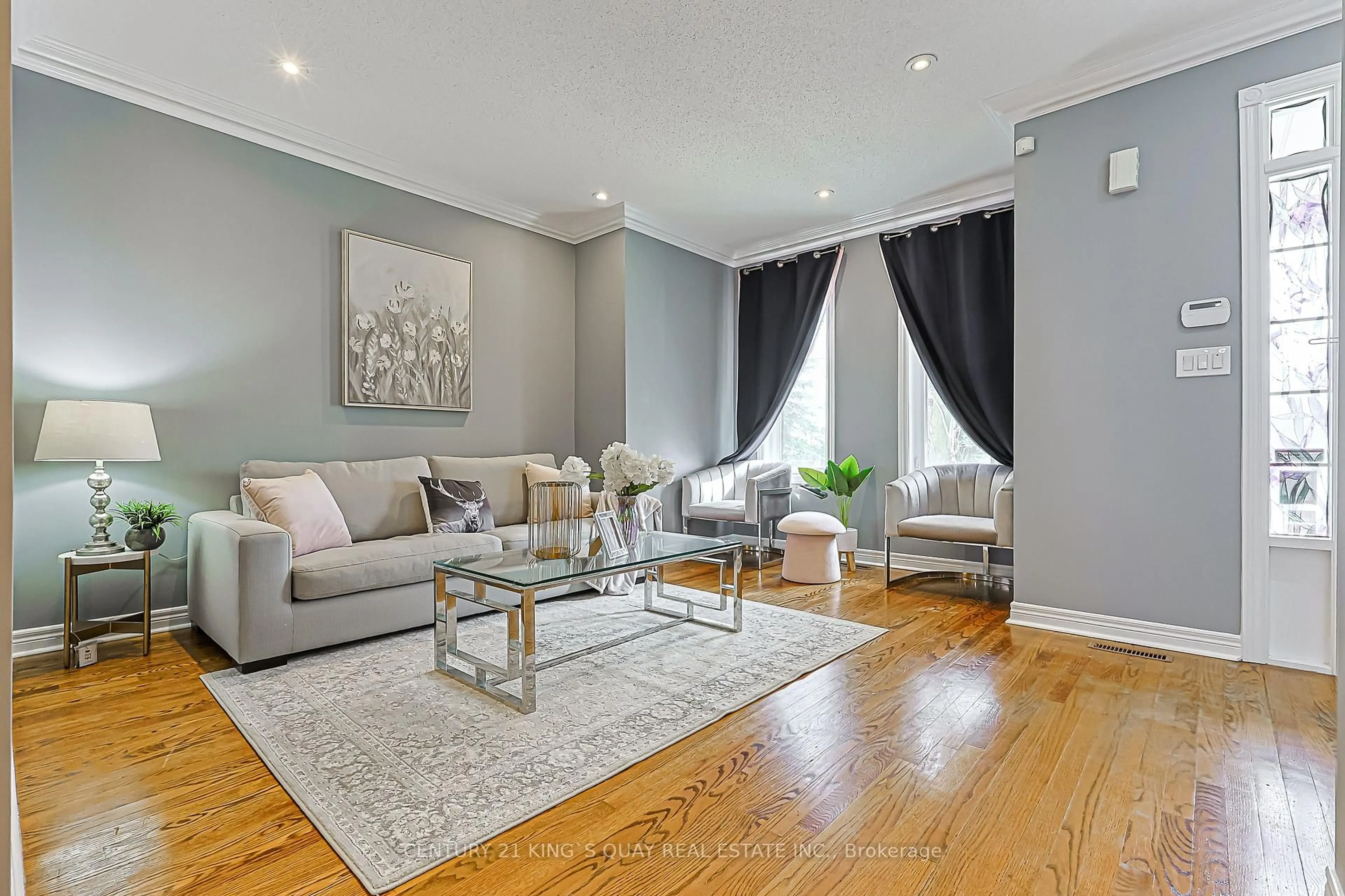 Living room with furniture, wood/laminate floor for 15 Queens Plate Dr, Markham Ontario L6C 2A9