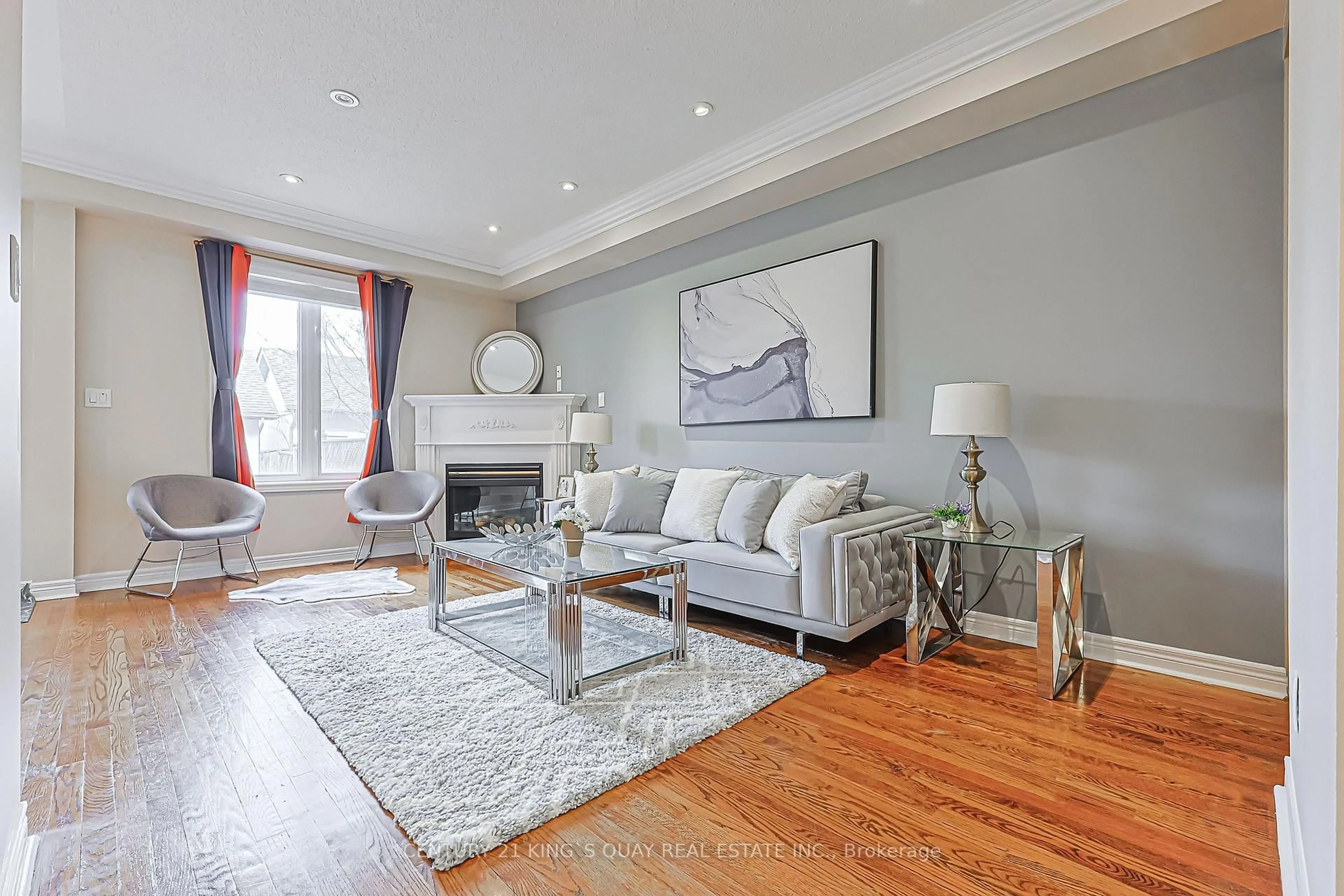 Living room with furniture, wood/laminate floor for 15 Queens Plate Dr, Markham Ontario L6C 2A9